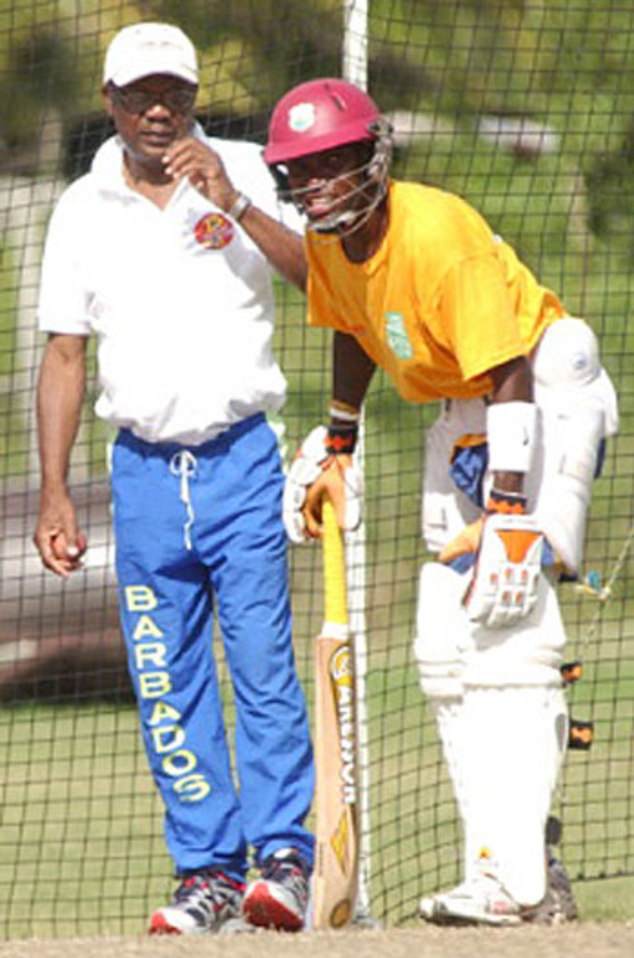 Seymour Nurse oversees Fidel Edwards in the nets at Barbados's Yorkshire Sports Club, Barbados, December 31, 2006