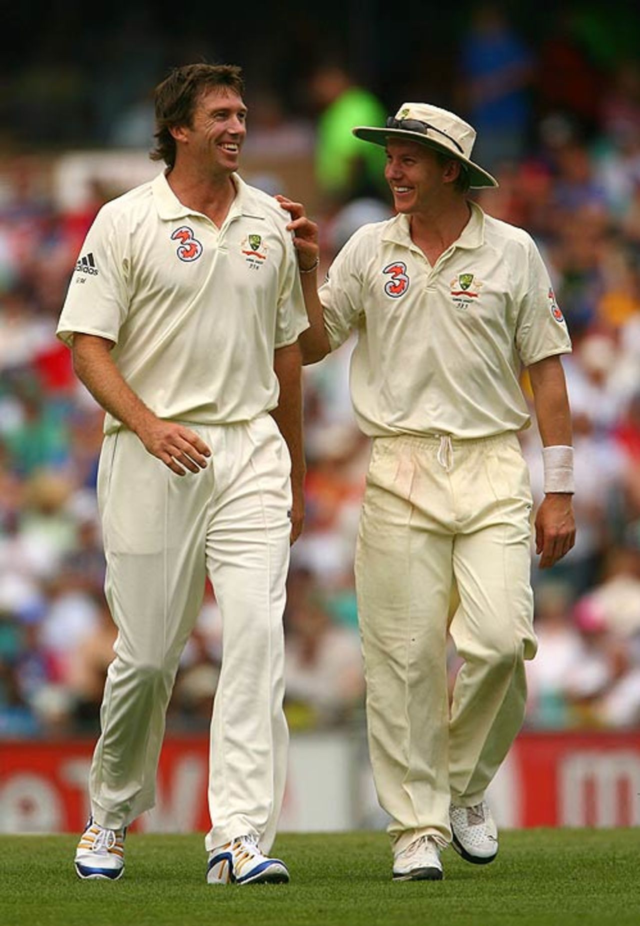 Brett Lee and Glenn McGrath are all smiles as McGrath walks back to his mark, Australia v England, 5th Test, Sydney, January 2, 2007