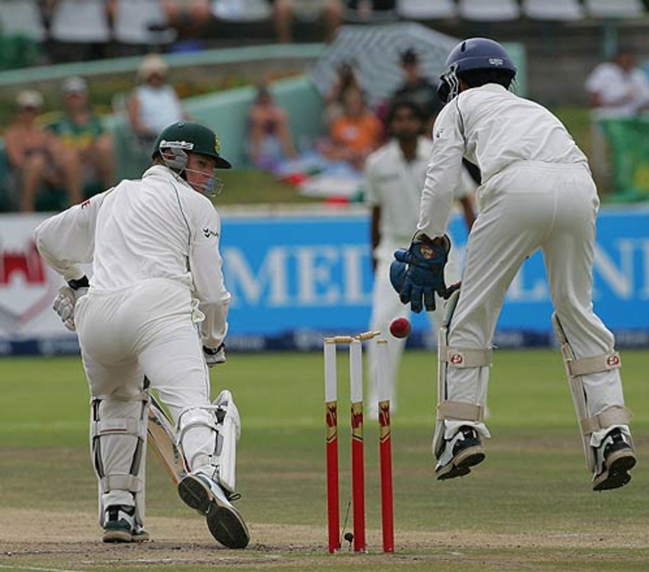 Shaun Pollock gets beaten by one that bounces off Dinesh Karthik's gloves on to the stumps, South Africa v India, 3rd Test, Cape Town, 5th day, January 6, 2007
