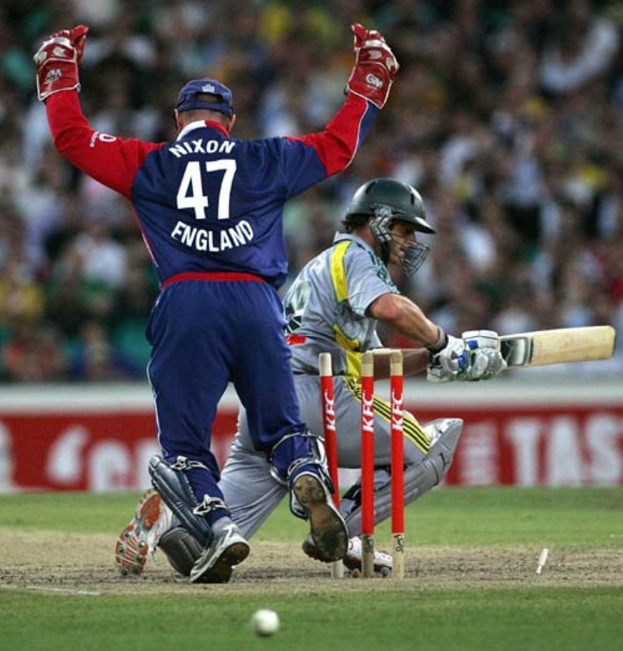 Paul Nixon celebrates as Adam Gilchrist is bowled by Monty Panesar, Australia v England, Only Twenty20, Sydney, January 9, 2007