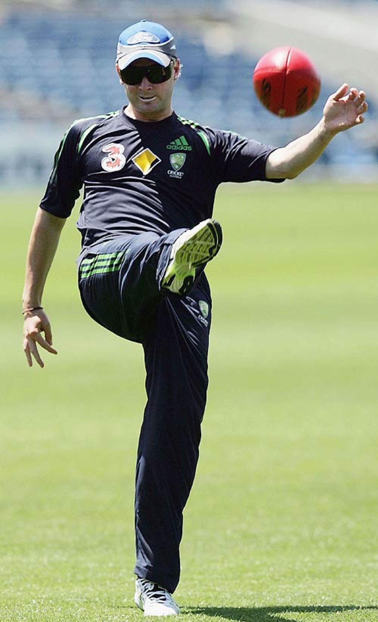Michael Clarke warms up with some Aussie rules football, Geelong, January 10, 2007