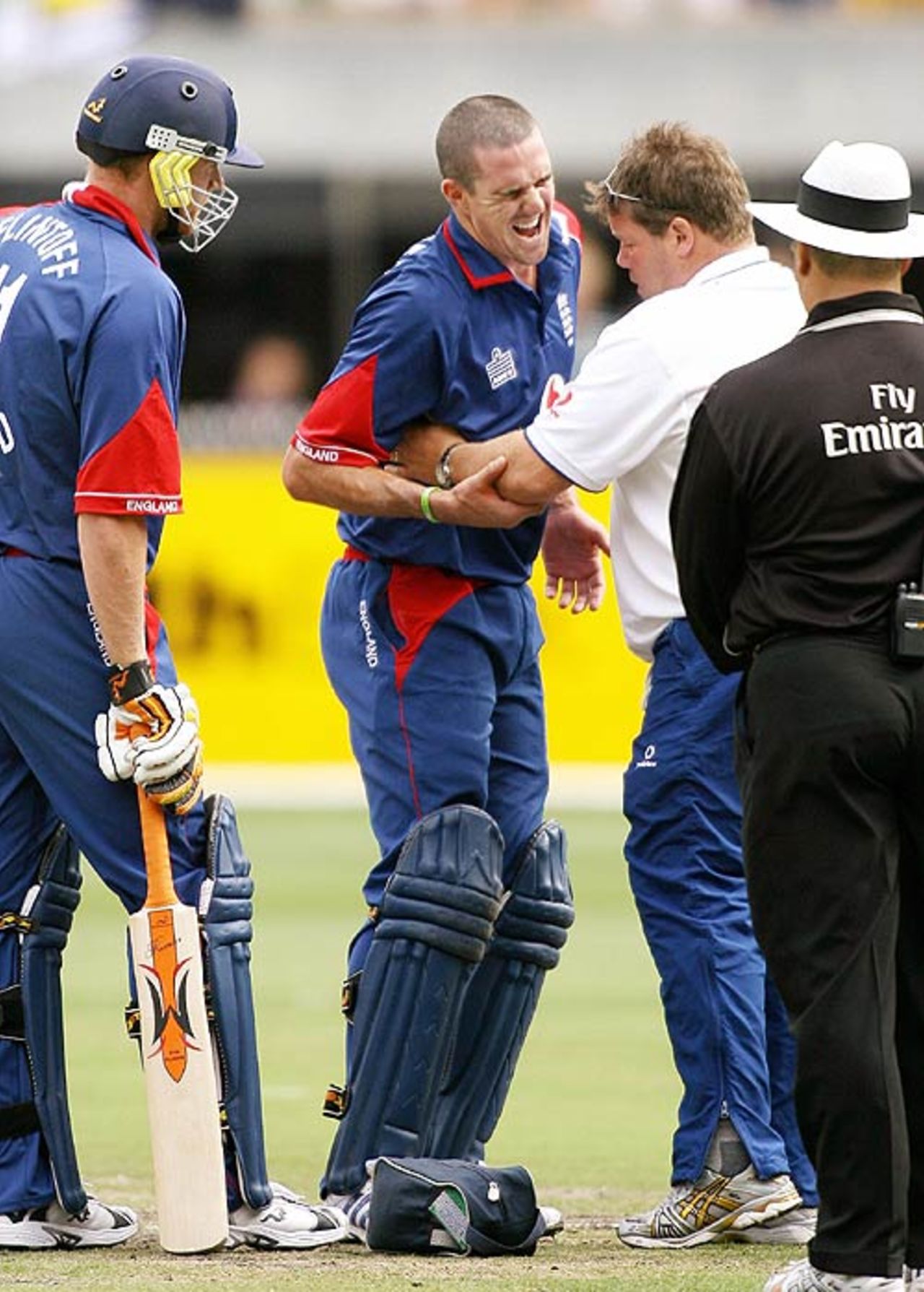 The physio attends to Kevin Pietersen's rib cage, Australia v England, Commonwealth Bank Series, 1st Match, Melbourne, January 12, 2007