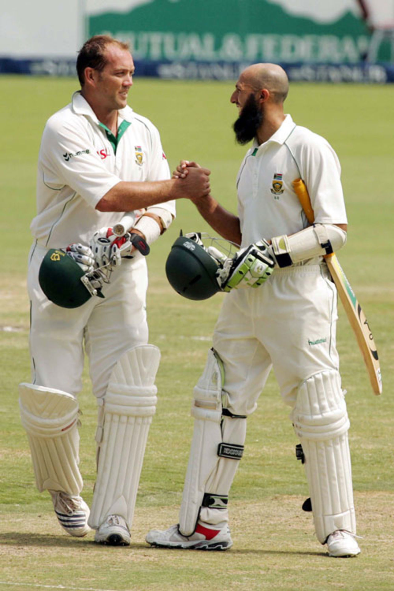 Jacques Kallis and Hashim Amla walk off after clinching victory, South Africa v Pakistan, 1st Test, Centurion Park, January 15, 2007
