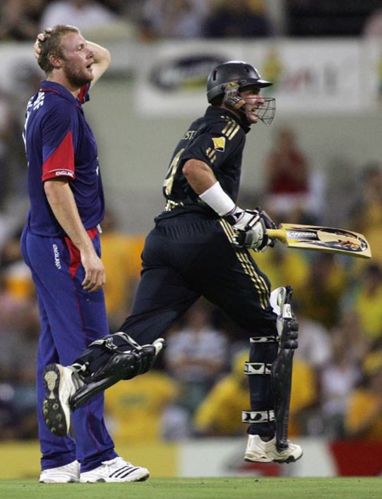 Andrew Flintoff looks on as Michael Hussey steals another run, Australia v England, CB Series, 4th match, Brisbane, January 19, 2007