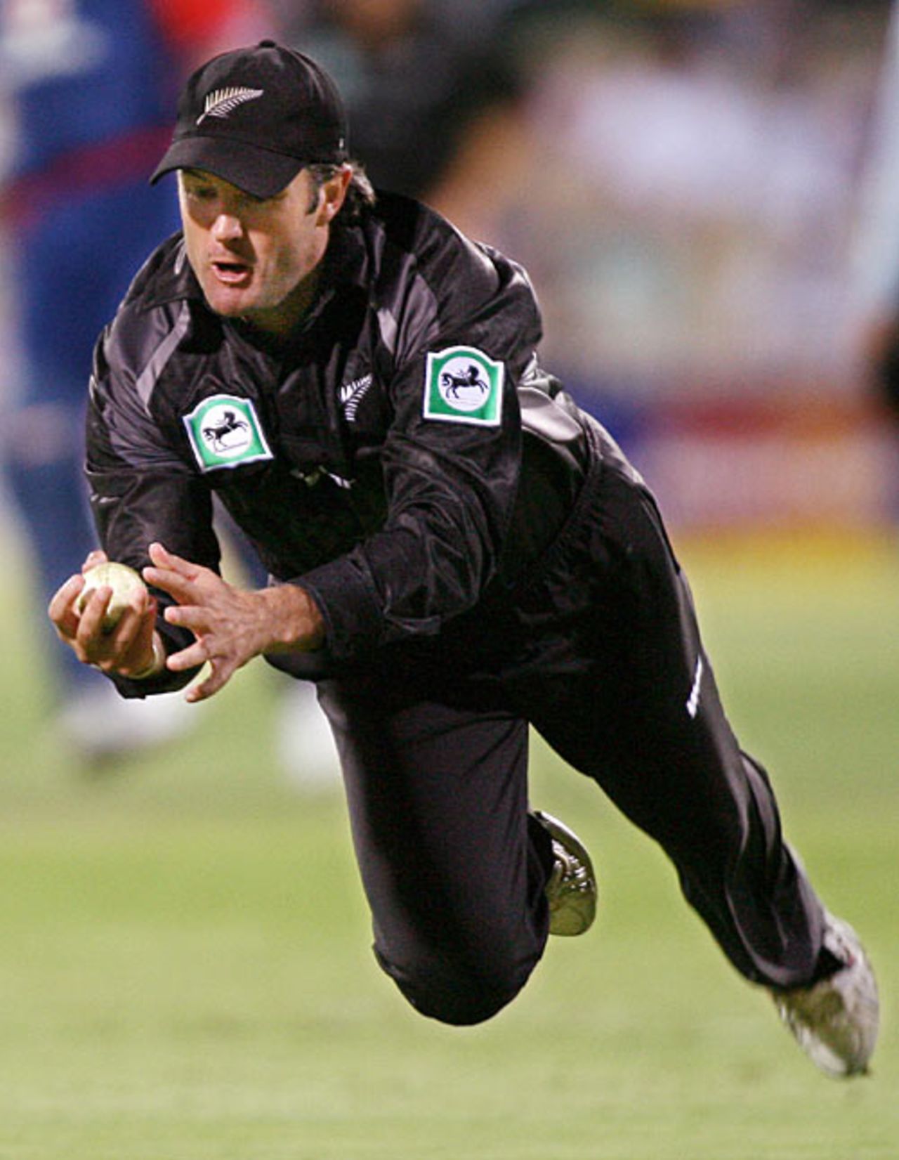 Nathan Astle keeps his eye on the ball to take a fine, low catch, England v New Zealand, CB Series, Adelaide, January 23, 2007