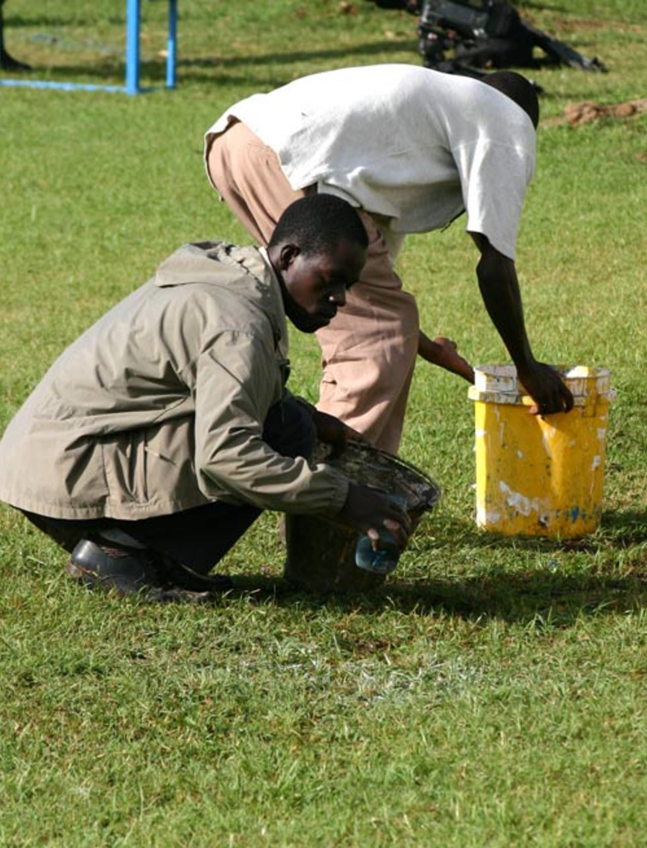 Groundsmen lift water from the outfield after heavy rain hit Nairobi, Kenya v Ireland, World Cricket League, Ruaraka, February 2, 2007