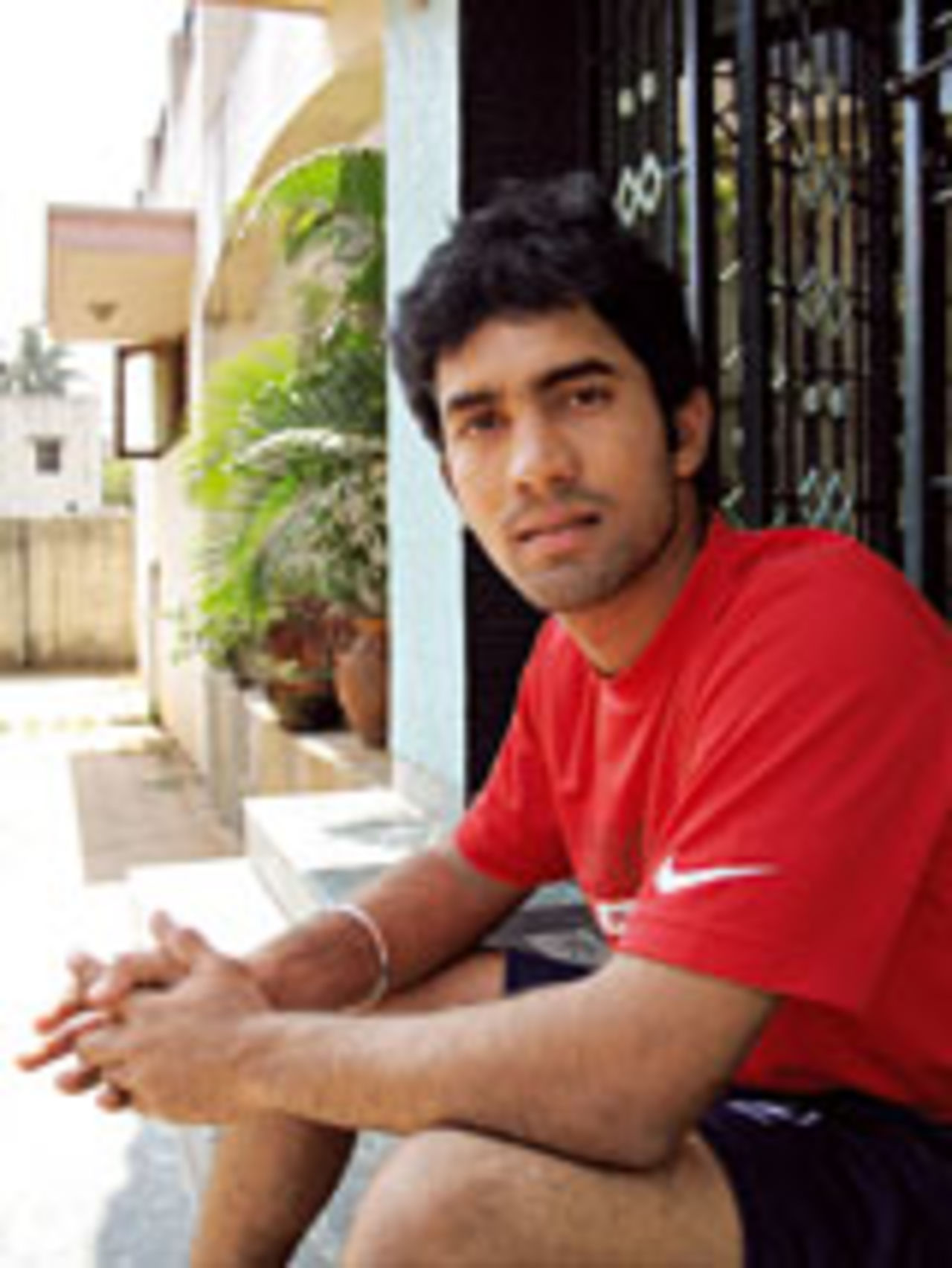 Dinesh Karthik photographed sitting on the steps of his house in Chennai in 2007