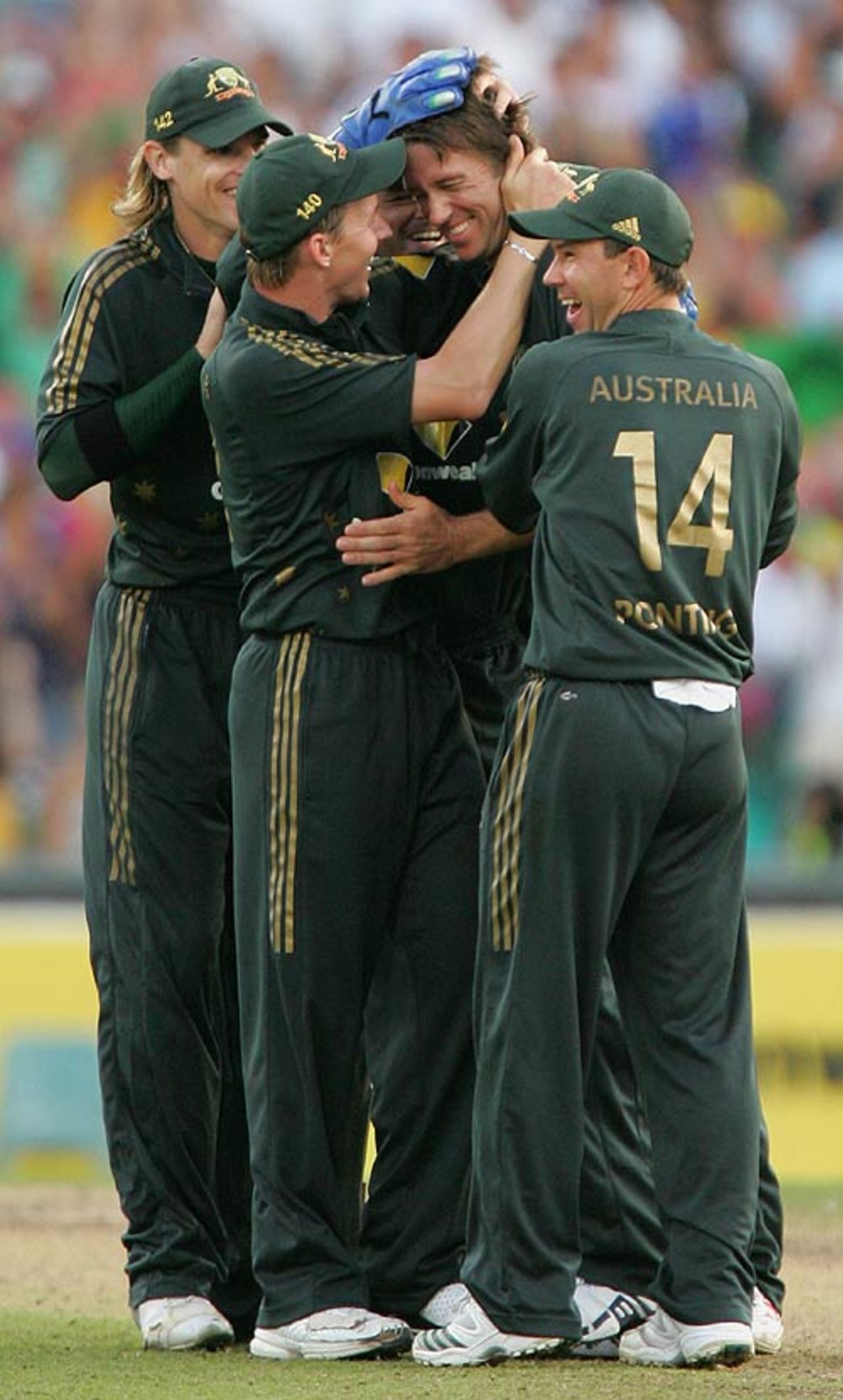 Glenn McGrath is swamped by his team-mates after taking a wicket with his last ball at the SCG, Australia v England, CB Series, 2nd final, Sydney, February 11, 2007