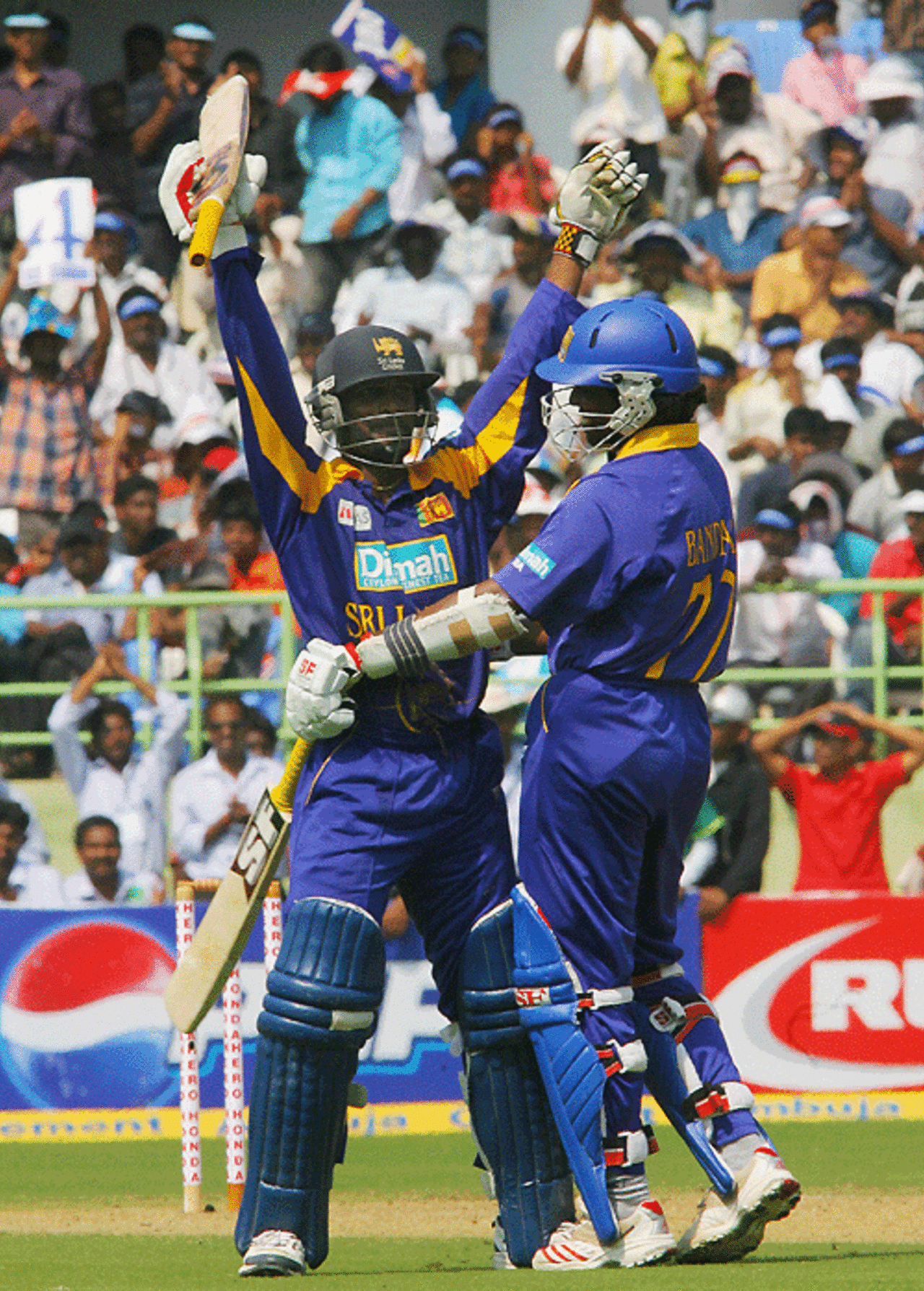 Malinga Bandara congratulates Chamara Silva on getting his maiden one-day hundred, India v Sri Lanka, 4th ODI, February 17, 2007