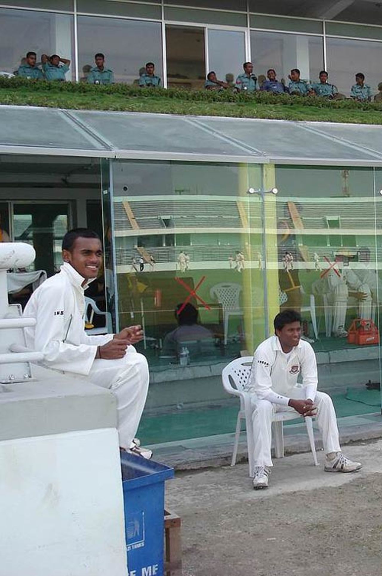 Mehrab Hossain Jr and Enamul Haque Jr watching the proceedings from the viewing area of the Bangladesh A dressing-room, England A v Bangladesh A, Sher-e-Bangla National Cricket Stadium, 1st day of four, February 22, 2007