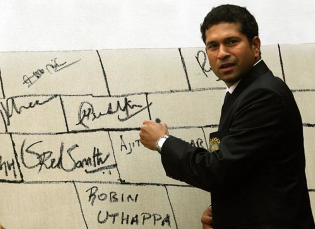 Sachin Tendulkar autographs a canvas prior to his departure for the ICC World Cup, Mumbai, February 28, 2007