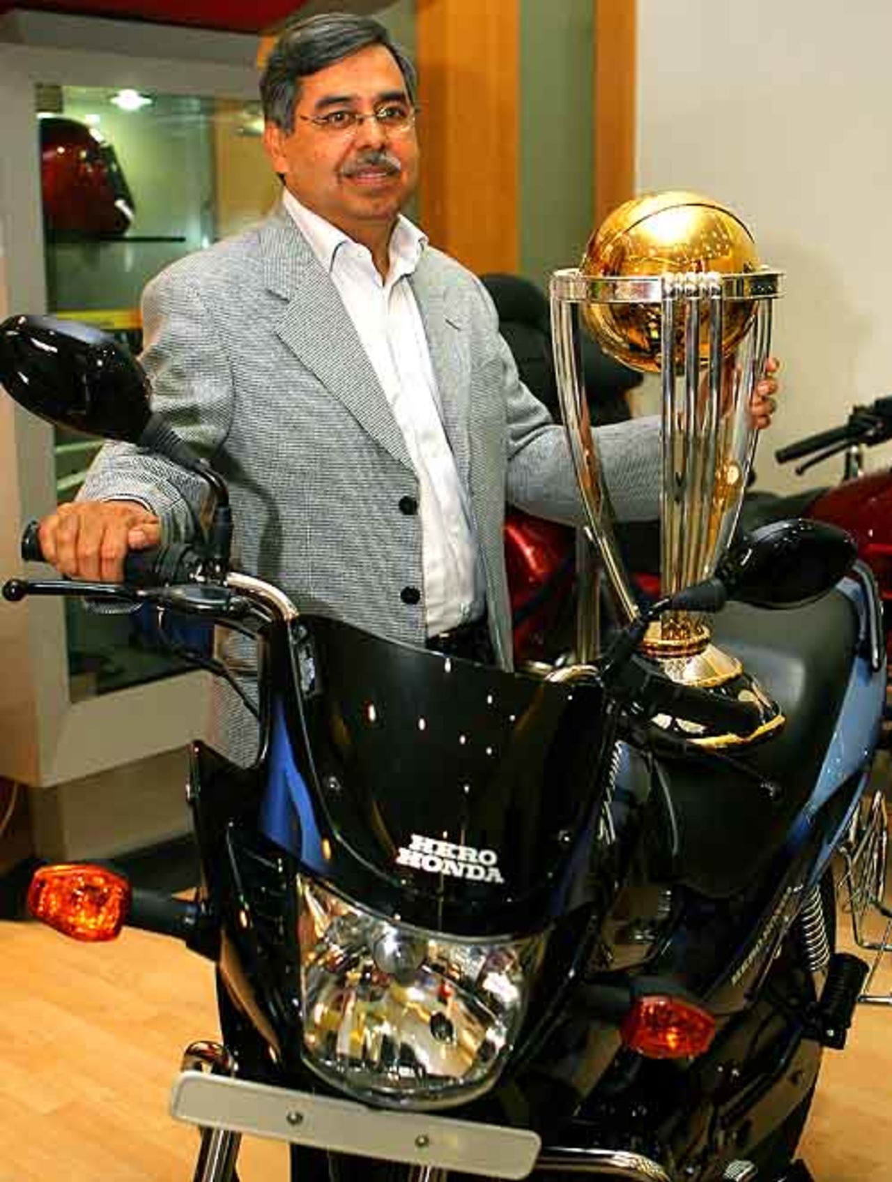 CEO of Hero Honda Motors Limited, Pawan Munjal holds the ICC 'Cricket World Cup 2007' Trophy, Mumbai, March 5, 2007