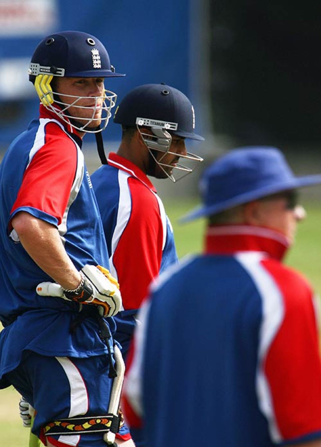 Andrew Flintoff and Ravi Bopara wait for a chance to bat as Duncan Fletcher looks on, Kingstown, St Vincent, March 7, 2007