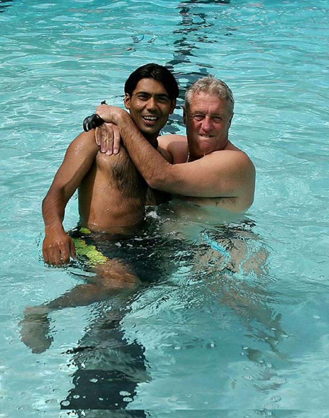 Mohammad Sami and Bob Woolmer share a light moment in the swimming pool, Trinidad, March 7, 2007