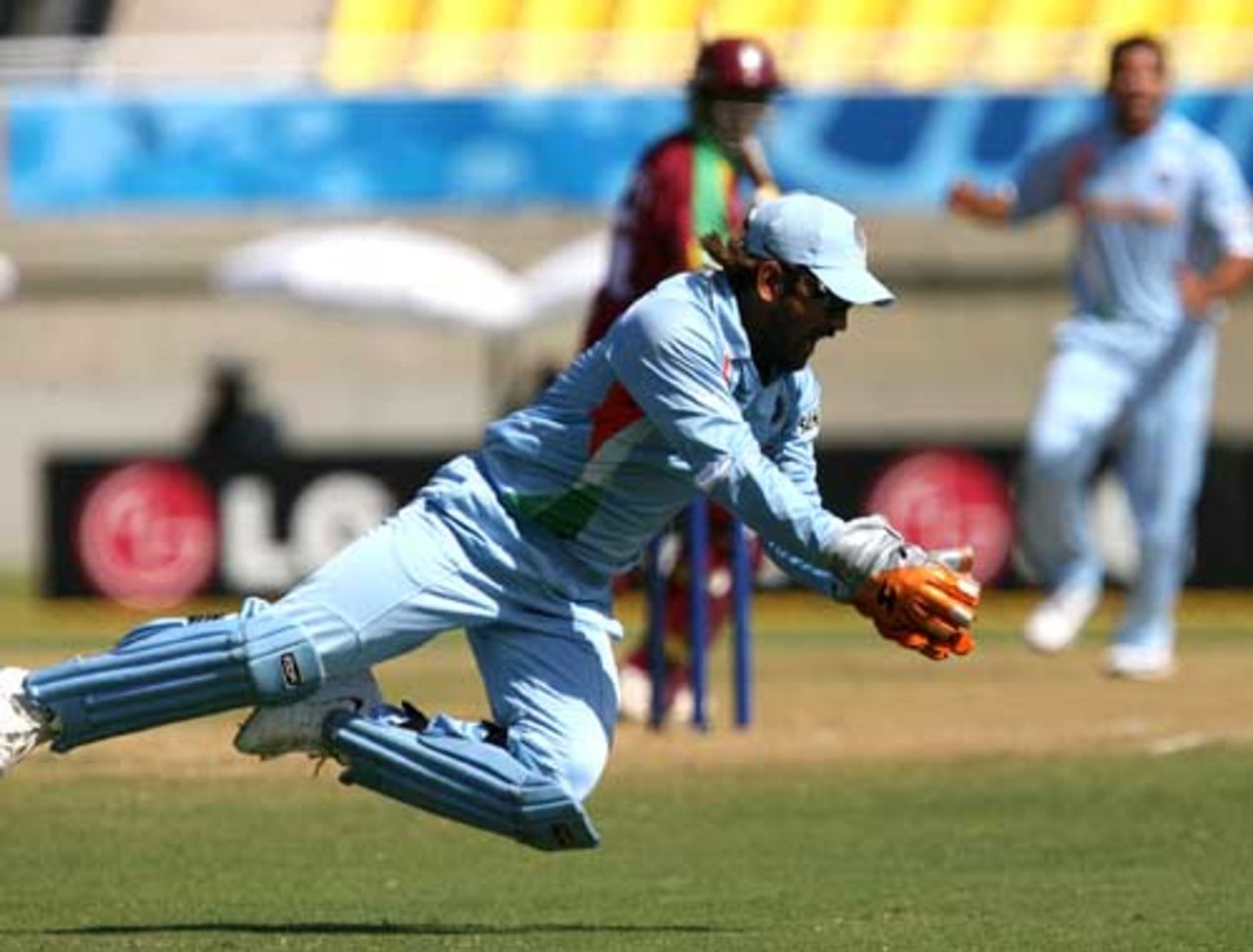 Mahendra Singh Dhoni dives to his left to take a touch catch to get rid of Shivnarine Chanderpaul, India v West indies warm up match, Trelawny, Jamaica, March 9, 2007