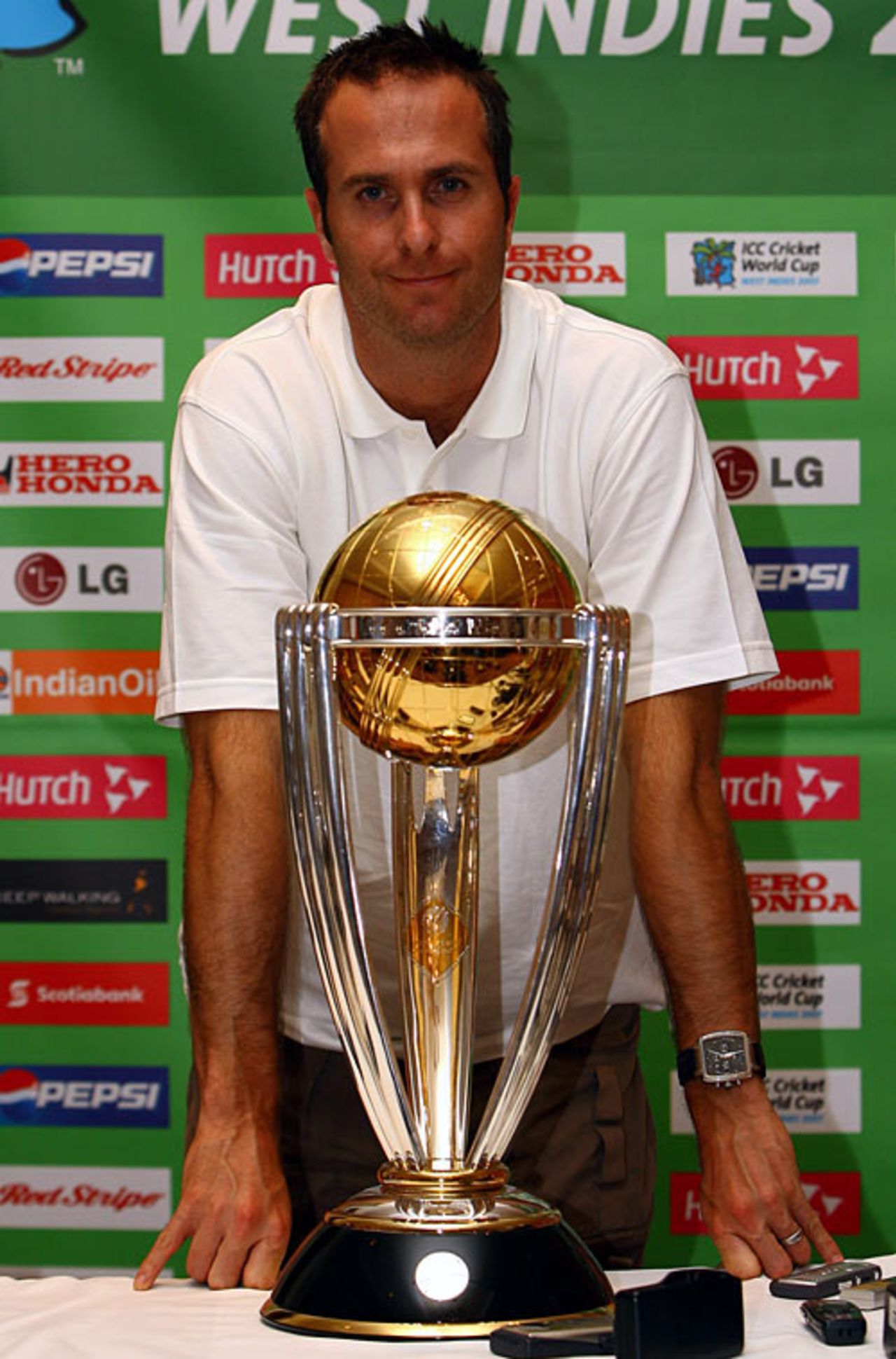 Michael Vaughan poses with the World Cup trophy at a press conference in Montego Bay, Jamaica, March 11, 2007