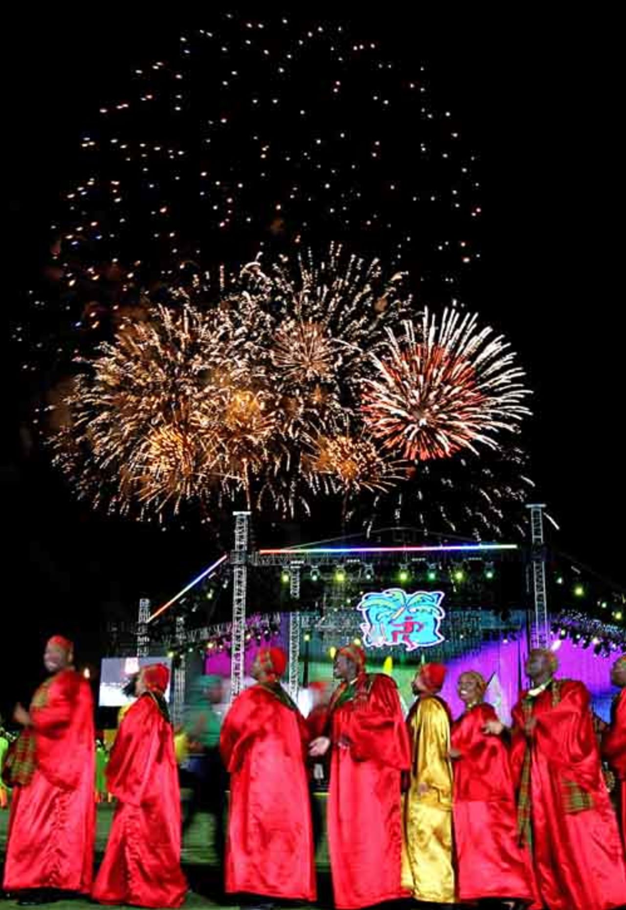 Dancers perform as fireworks illuminate the night sky during the opening ceremony of the 2007 World Cup Cricket,Trelawny, March 11, 2007