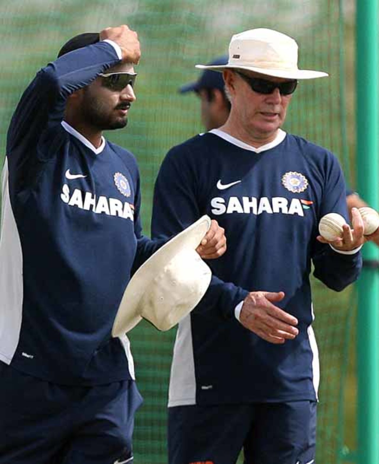 Harbhajan Singh and Greg Chappell have a chat during India's practice session at Couva, Trinidad, March 14, 2007