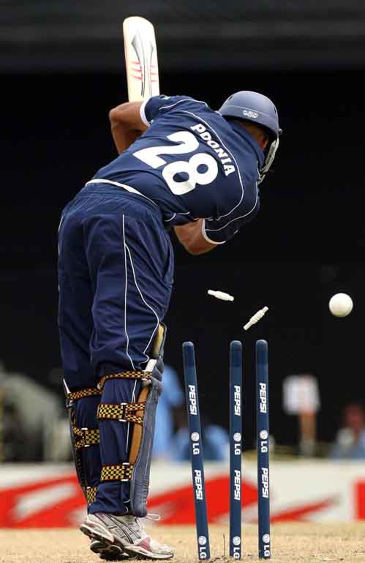 Navdeep Poonia is all squared up by a Shaun Tait yorker, Australia v Scotland, Group A, Basseterre, 2007 World Cup, March 14, 2007