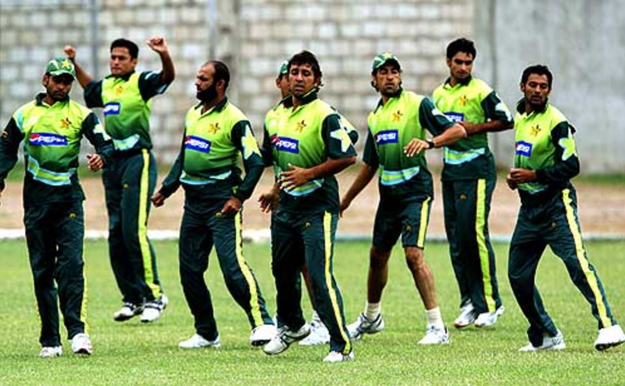 Pakistani cricketers stretches during a practice session in Kingston, Jamaica, March 15, 2007