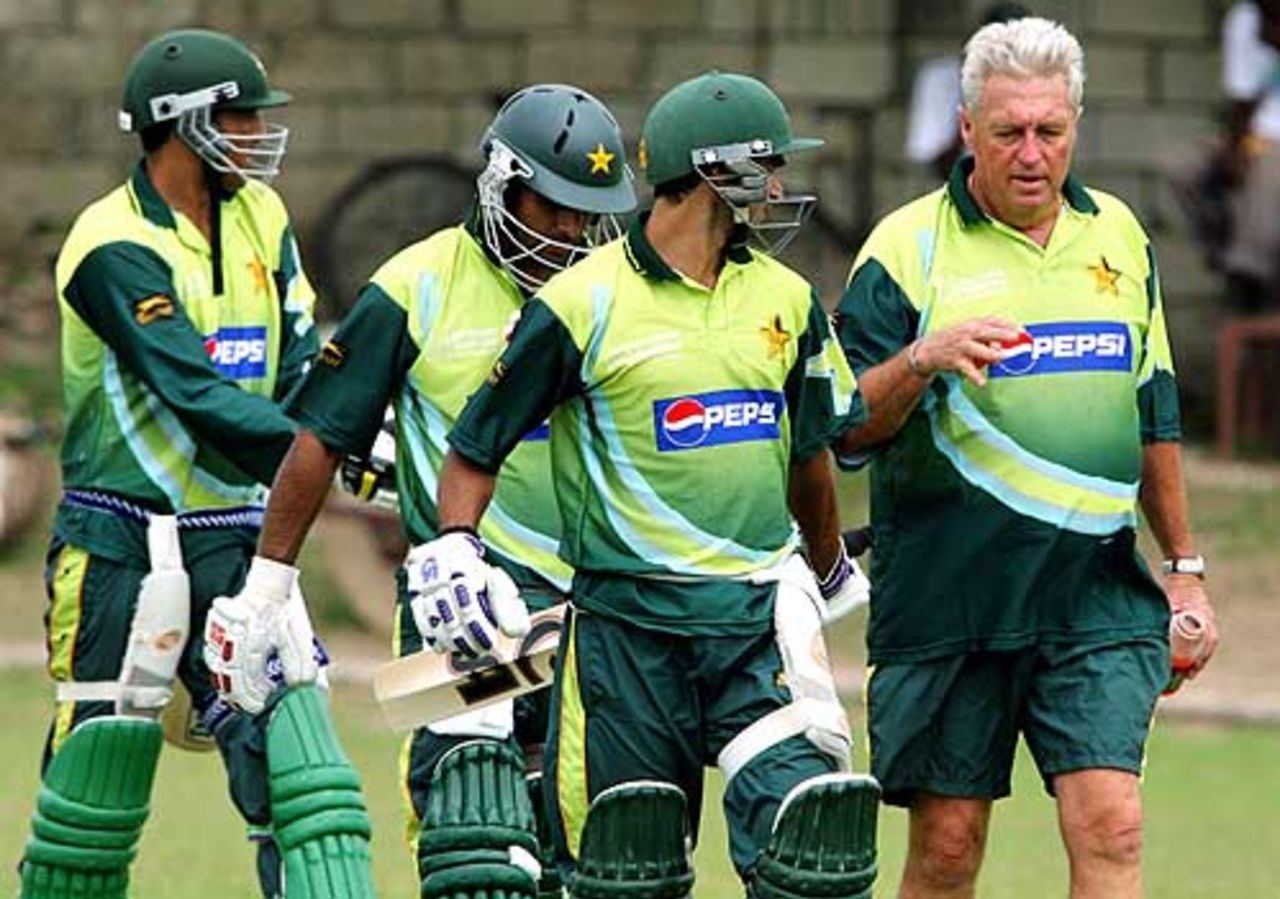 Top-order trouble: Bob Woolmer in consultation with Imran Nazir, Mohammad Hafeez  and Younis Khan during a practice session in Kingston, Jamaica, March 15, 2007