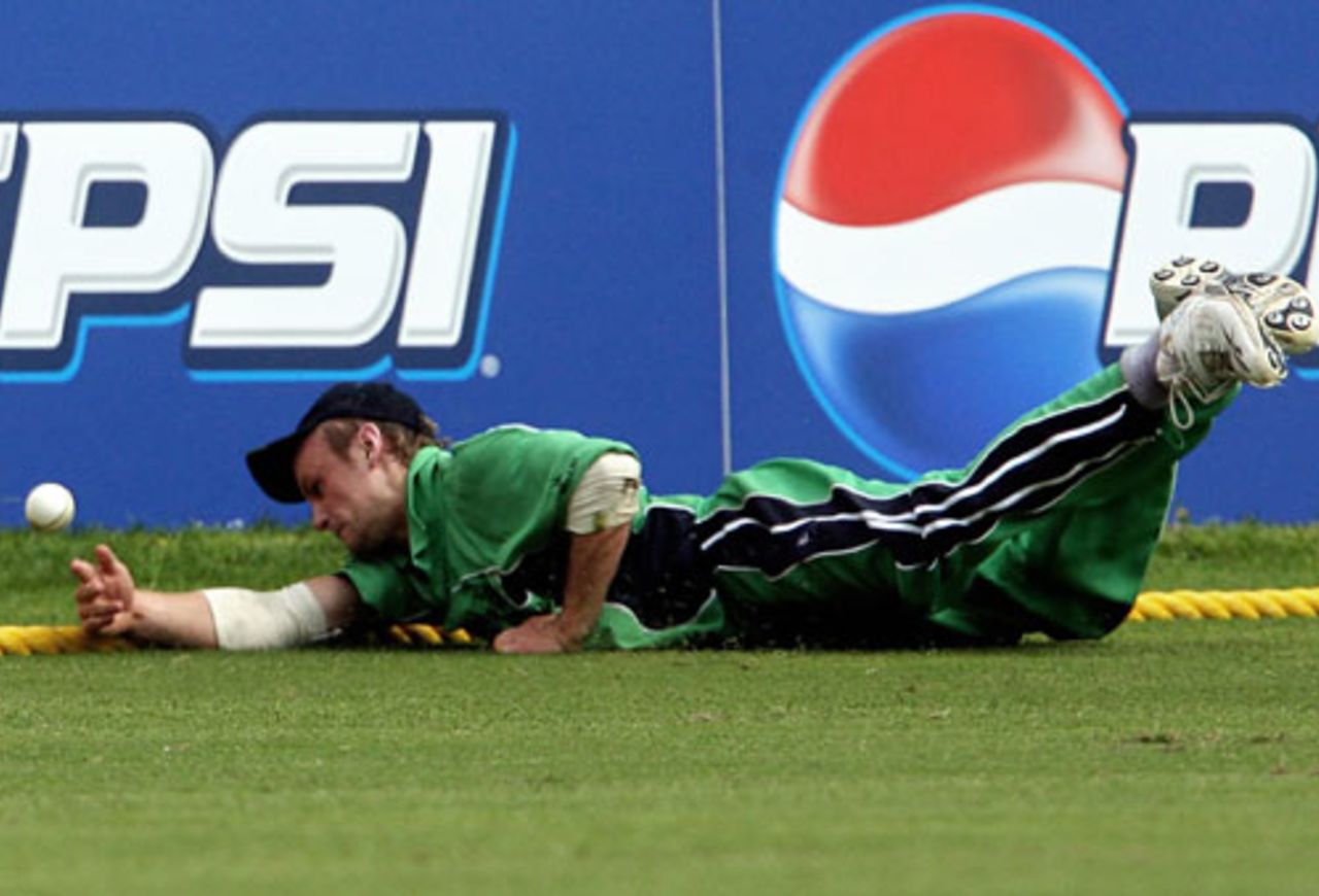 William Potterfield dives on the ropes to try and save a boundary, Ireland v Zimbabwe, Group D, Jamaica, March 15, 2007
