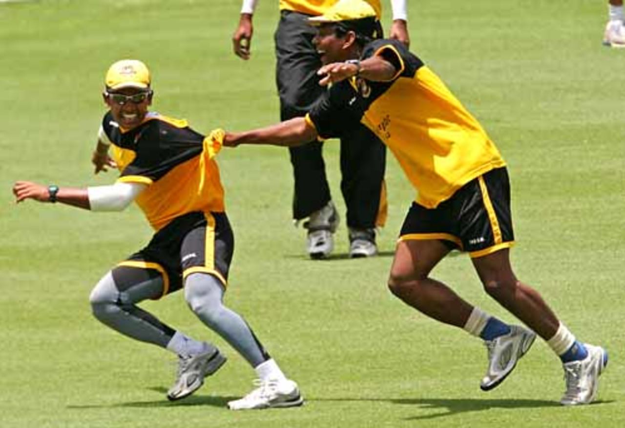 Mohammad Rafique and Mushfiqur Rafique seem to be playing tag at Bangladesh's training session, Trinidad, March 16, 2007
