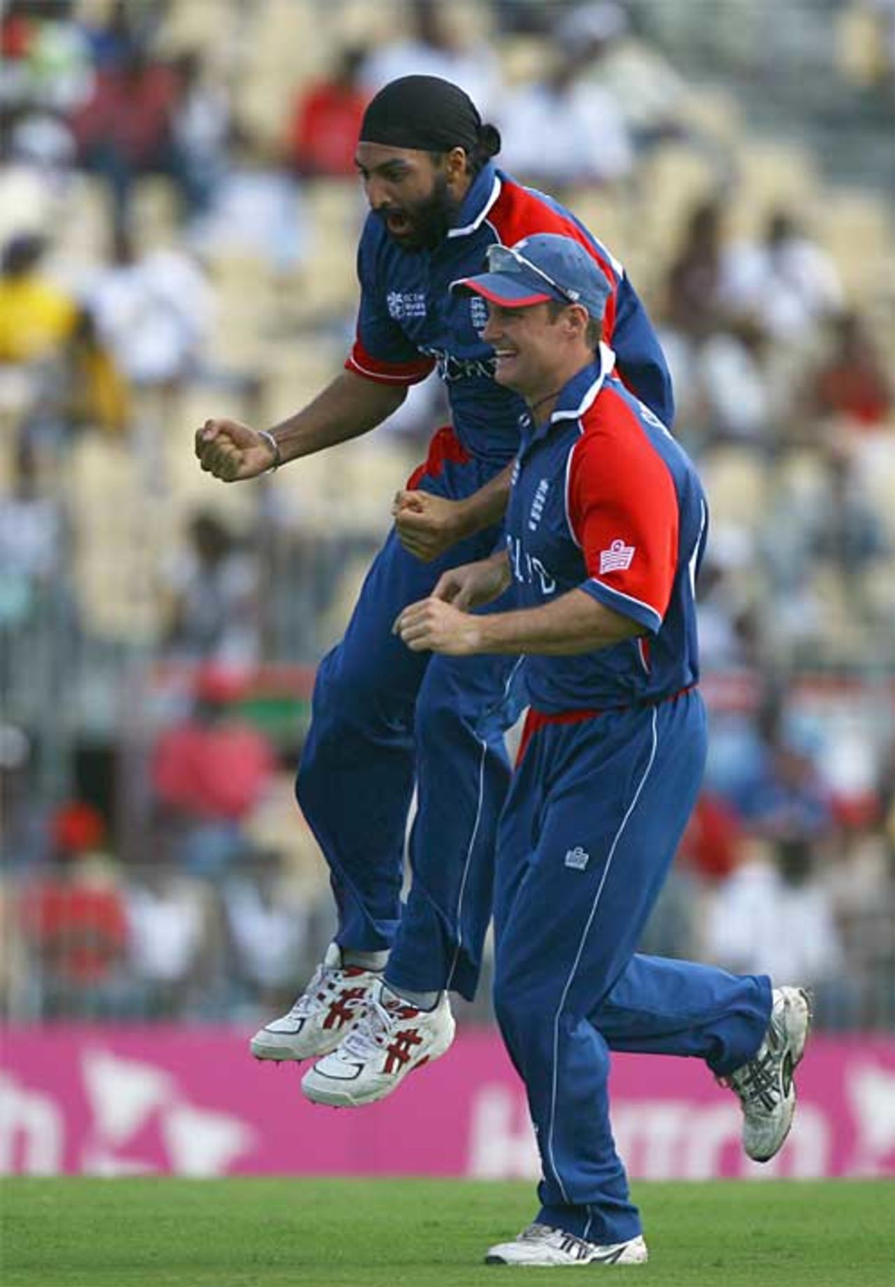 Monty Panesar celebrates with Andrew Strauss after capturing Craig McMillan with his second ball, England v New Zealand, Group C, Gros Islet, March 16, 2007