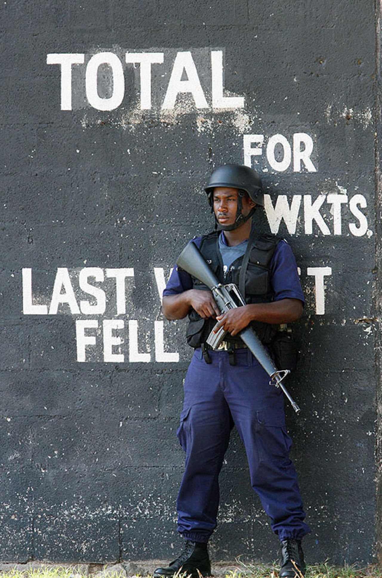 Protecting the wicket: A security guard, M16 et al, stands by during Pakistan's net practice, Kingston, March 16, 2007