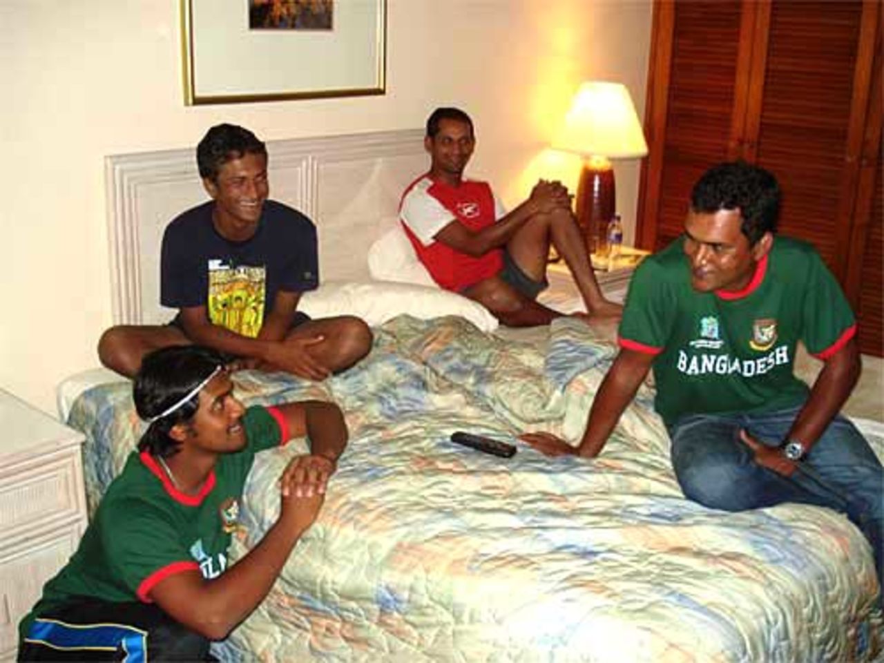 Shahriar Nafees, Saqibul Hasan, Habibul Bashar and Bangladesh's assistant coach Mohammad Salahuddin chat while watching the Zimbabwe-Ireland match on television, Port-of-Spain, Trinidad, March 16, 2007