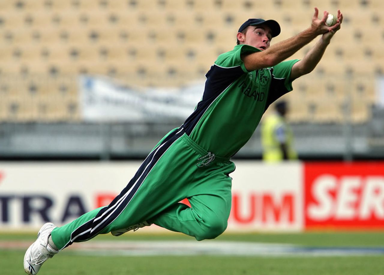 Trent Johnston dives to catch Kamran Akmal, winding himself in the process, Ireland v Pakistan, Group D, Jamaica, March 17, 2007