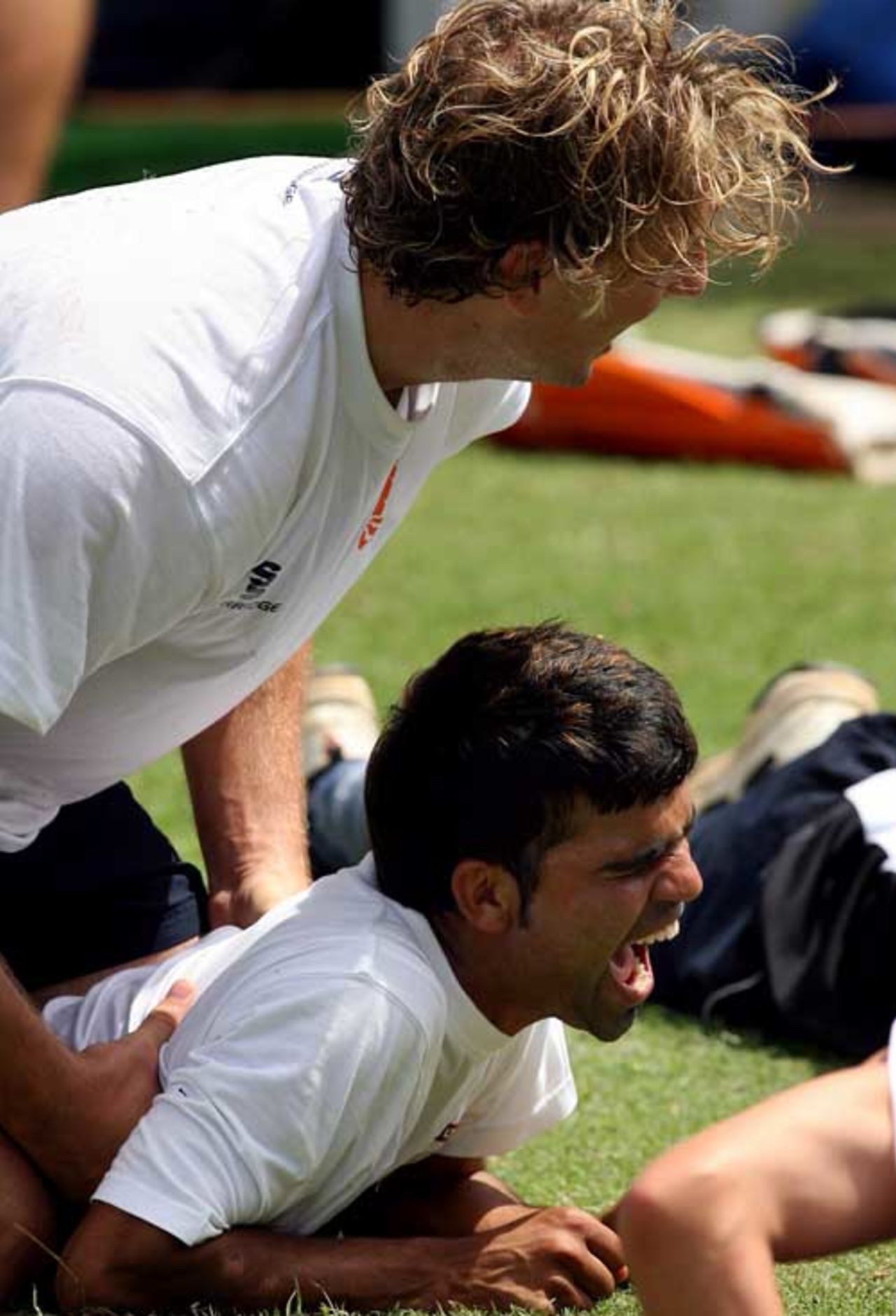 Netherlands bowler Daan van Bunge shares light moment with team-mate Mohammad Kashif, St Kitts, March 17, 2007