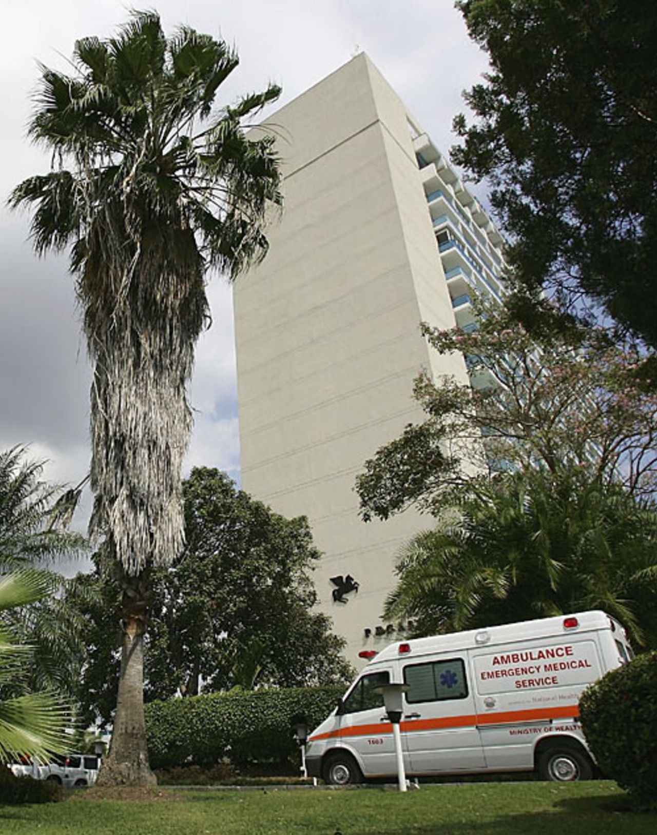 An ambulance is parked the Pakistan team hotel where Bob Woolmer was found unconscious in his hotel room, Kingston, Jamaica, March 18, 2007