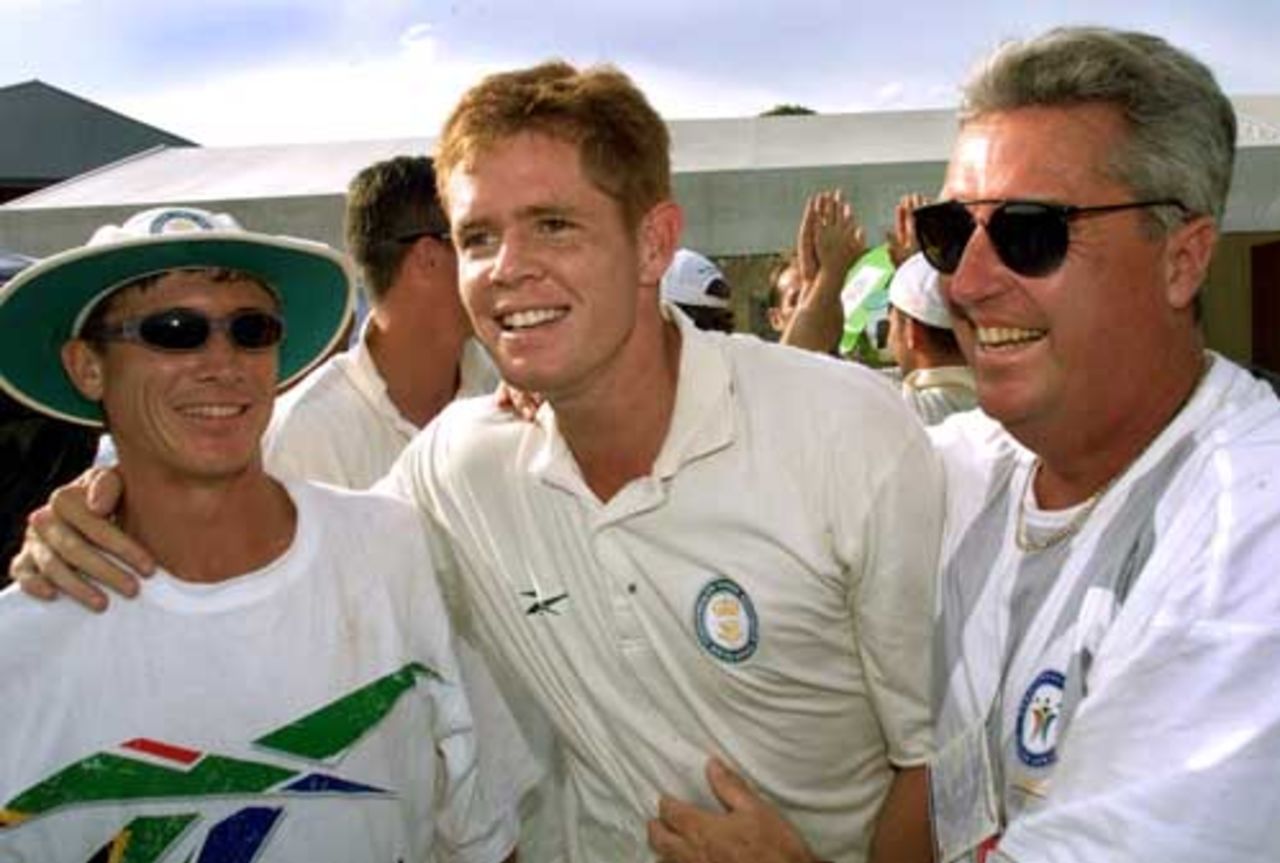 Bob Woolmer, Shaun Pollock and Alan Dawson celebrate South Africa's victory in the Commonwealth games, 1998