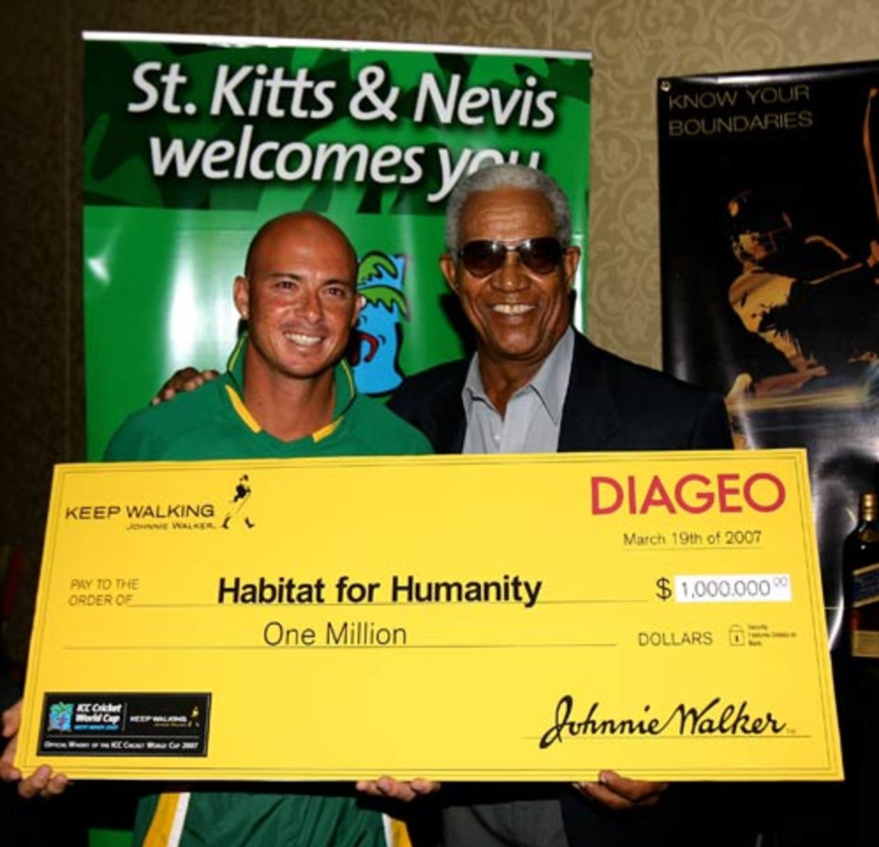 Herschelle Gibbs and Sir Garry Sobers pose with the cheque for Habitat for Humanity, St Kitts, March 19, 2007