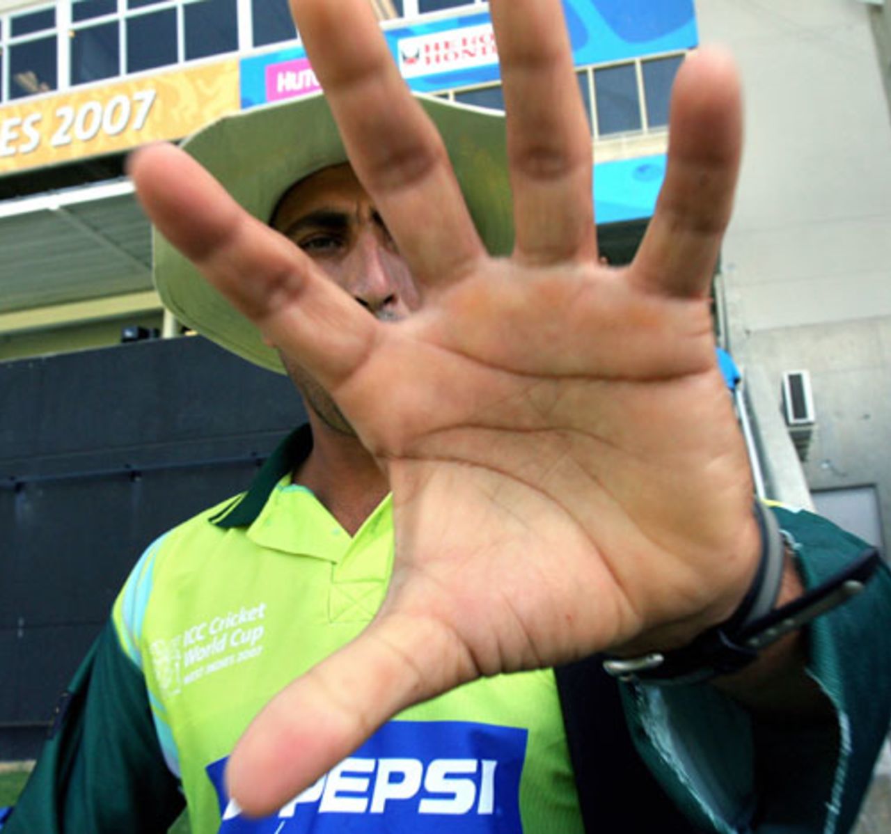 Younis Khan tries to keep a photographer at bay as Pakistan practice in Jamaica, Group D, Jamaica, March 20, 2007