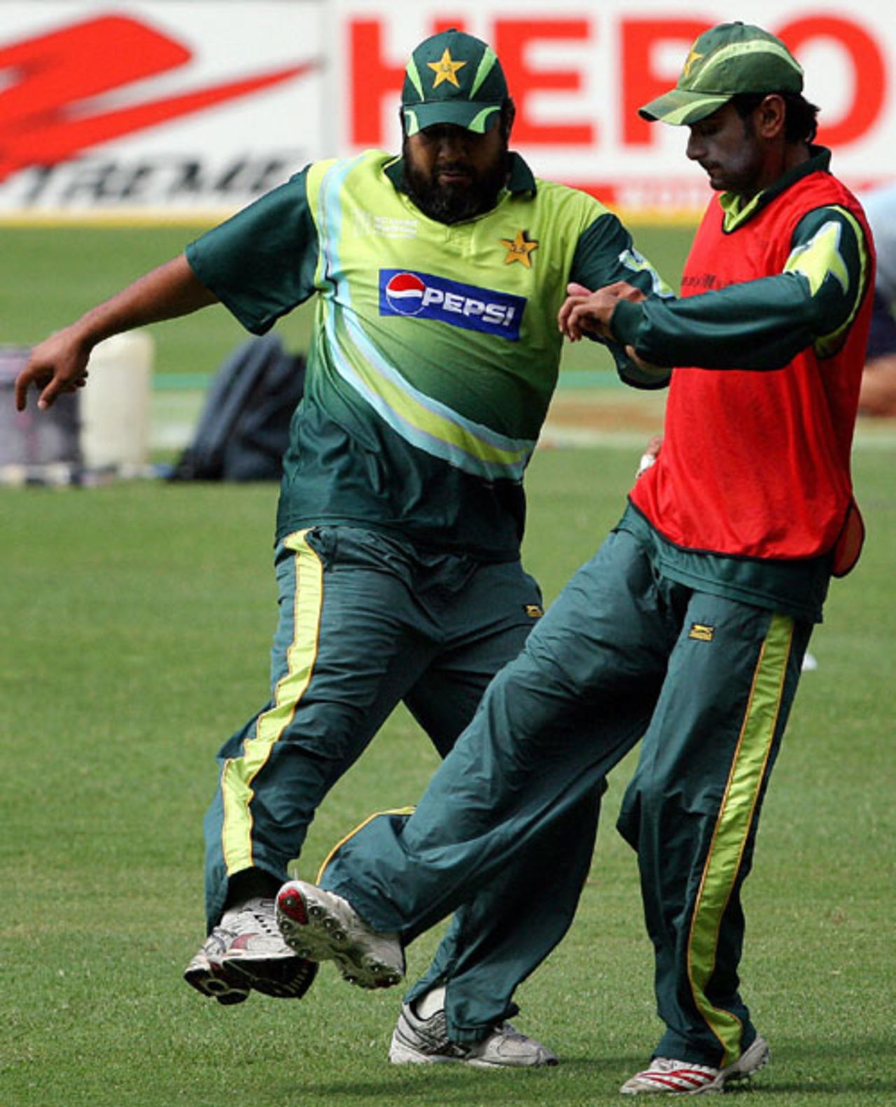 Inzamam-ul-Haq and Shoaib Malik play football as part of a practice session at the Sabina Park, Group D, Jamaica, March 20, 2007