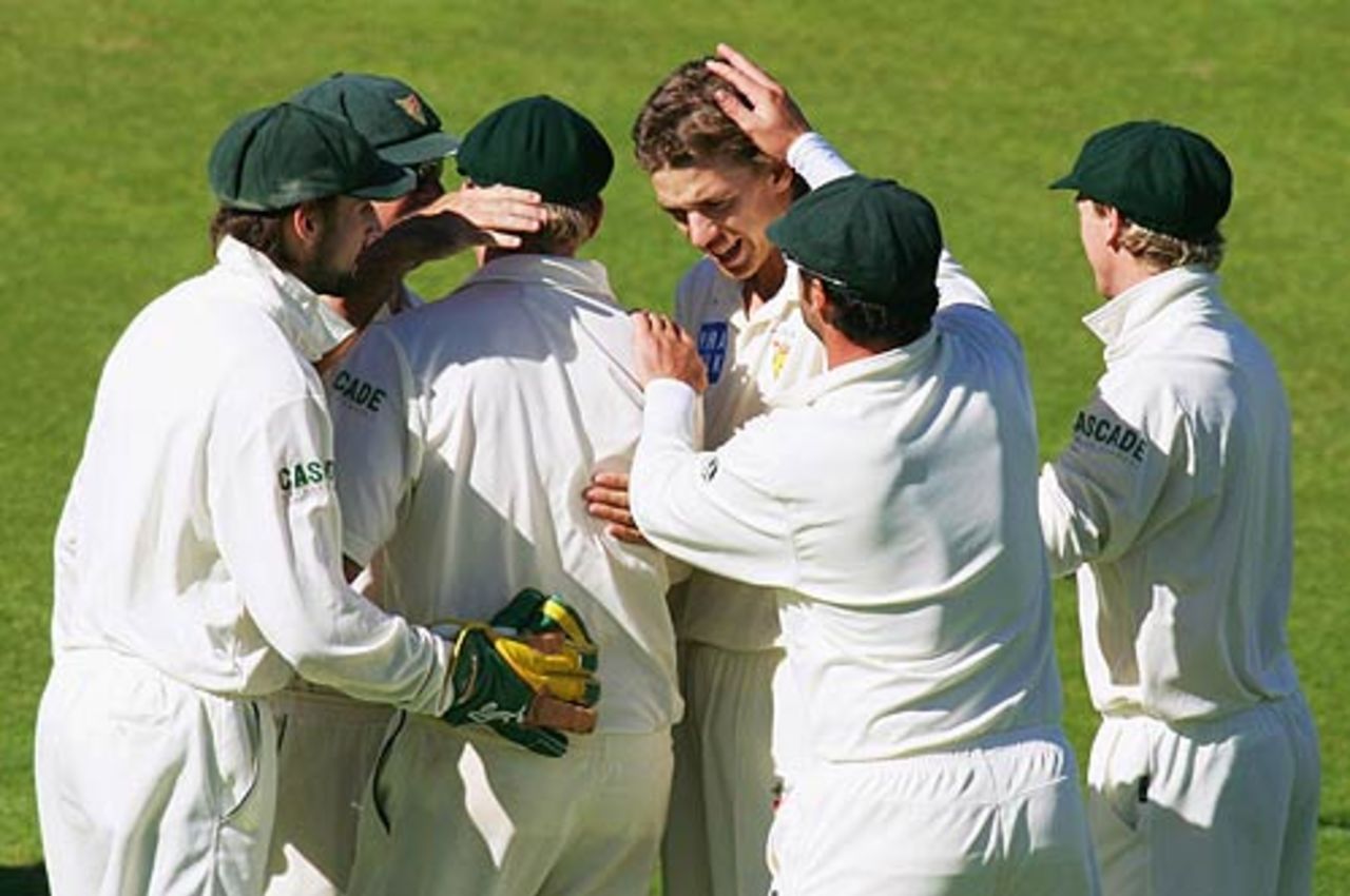 Luke Butterworth's team-mates congratulate him on another wicket, Tasmania v New South Wales, Pura Cup final, Hobart, March 21, 2007
