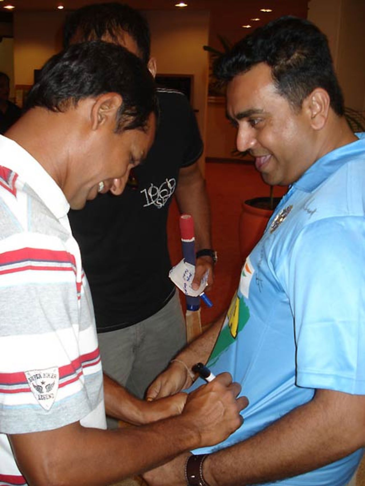 Habibul Bashar obliges an autograph from an Indian fan, Trinidad, March 20, 2007