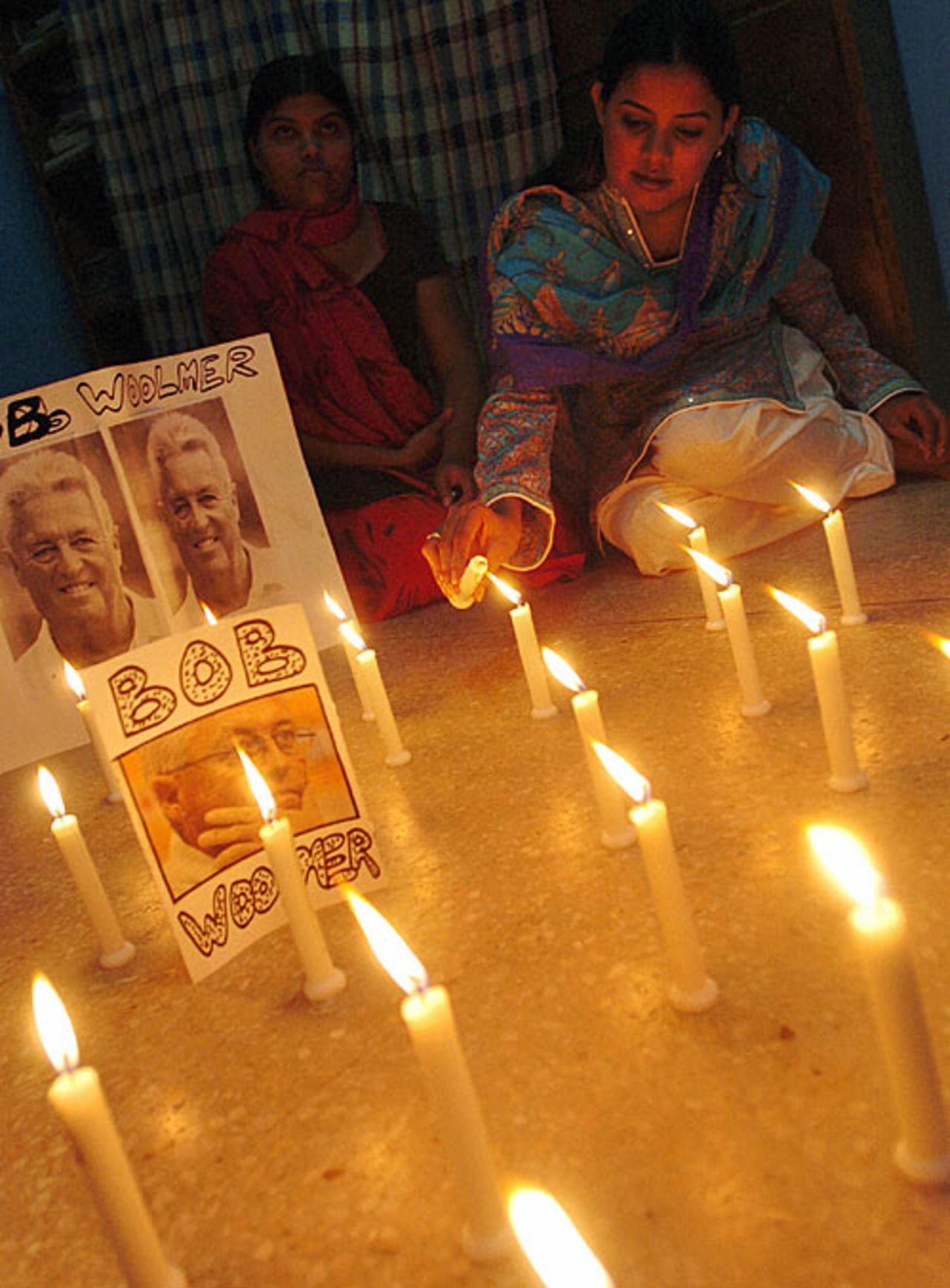 A Pakistan fan lights candles in memory of Bob Woolmer, March 21, 2007, Karachi