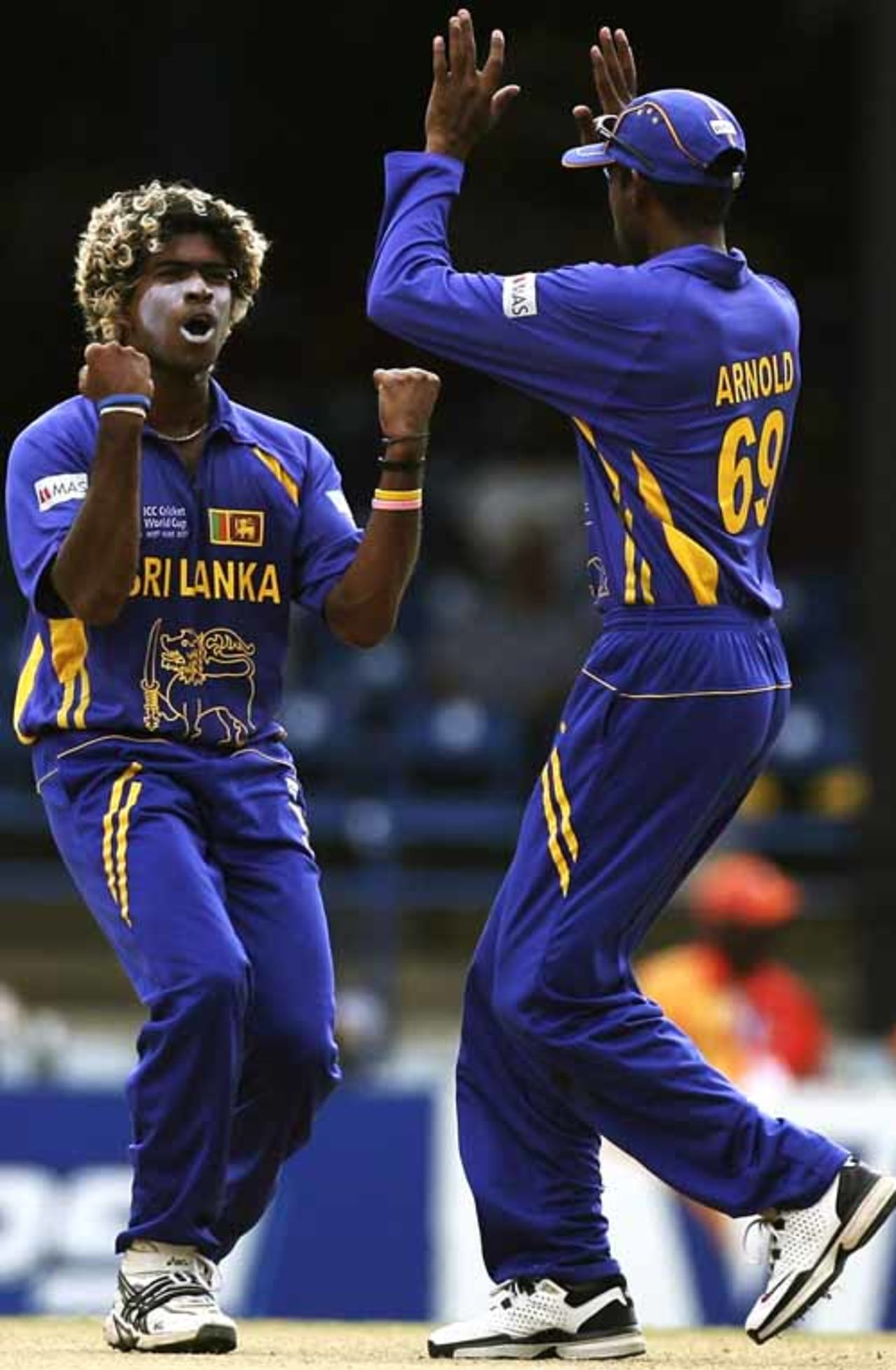 Lasith Malinga and Russel Arnold celebrate the wicket of Tamim Iqbal, Bangladesh v Sri Lanka, Group B, Trinidad, March 21, 2007