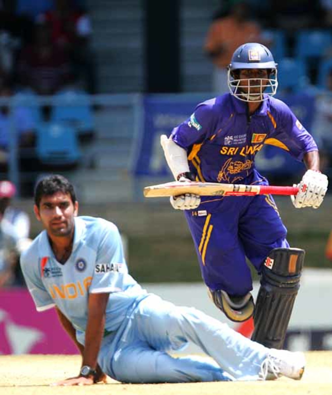 Upul Tharanga takes a run as Munaf Patel falls to the ground, India v Sri Lanka, Group B, Trinidad, March 23, 2007