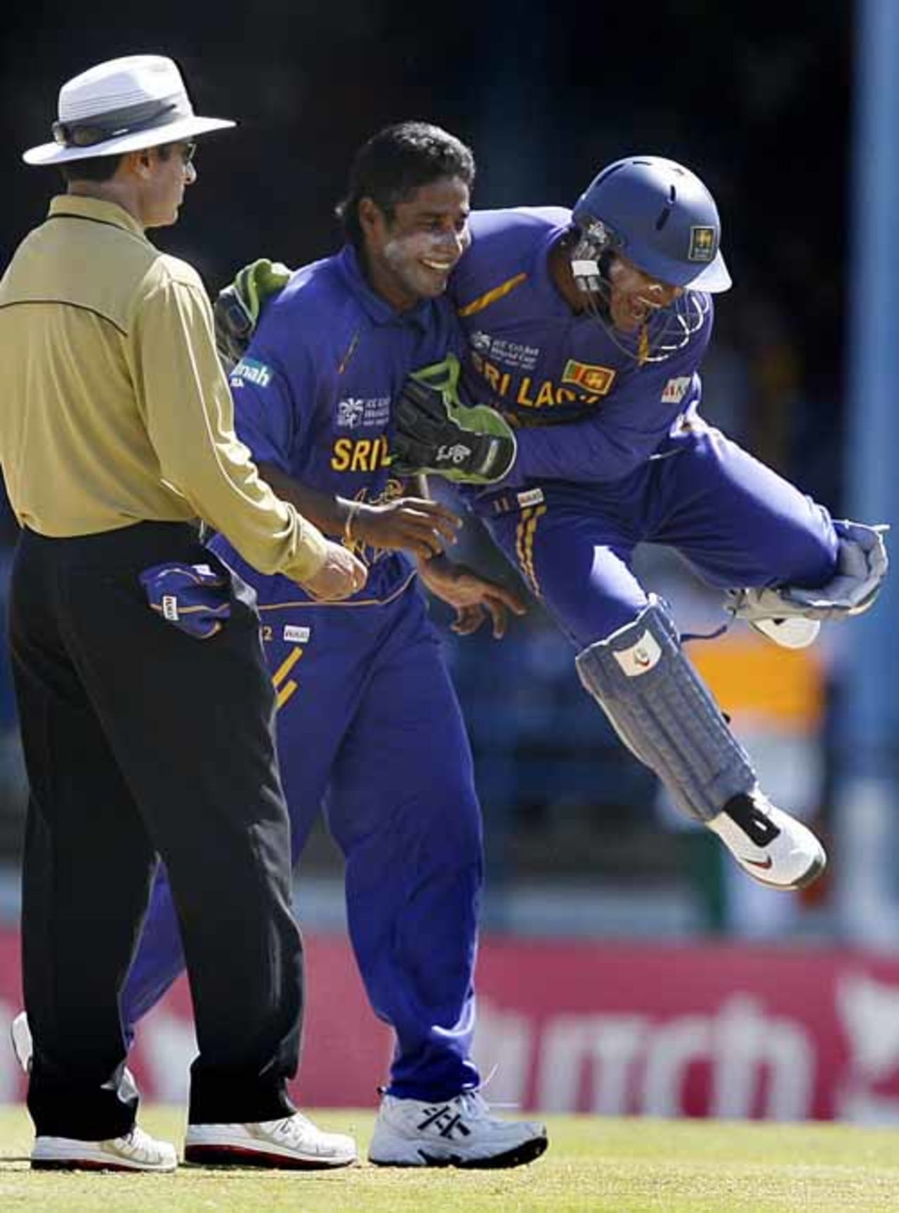 Kumar Sangakkara congratulates Chaminda Vaas on getting Saurav Ganguly, India v Sri Lanka, Group B, Trinidad, March 23, 2007
