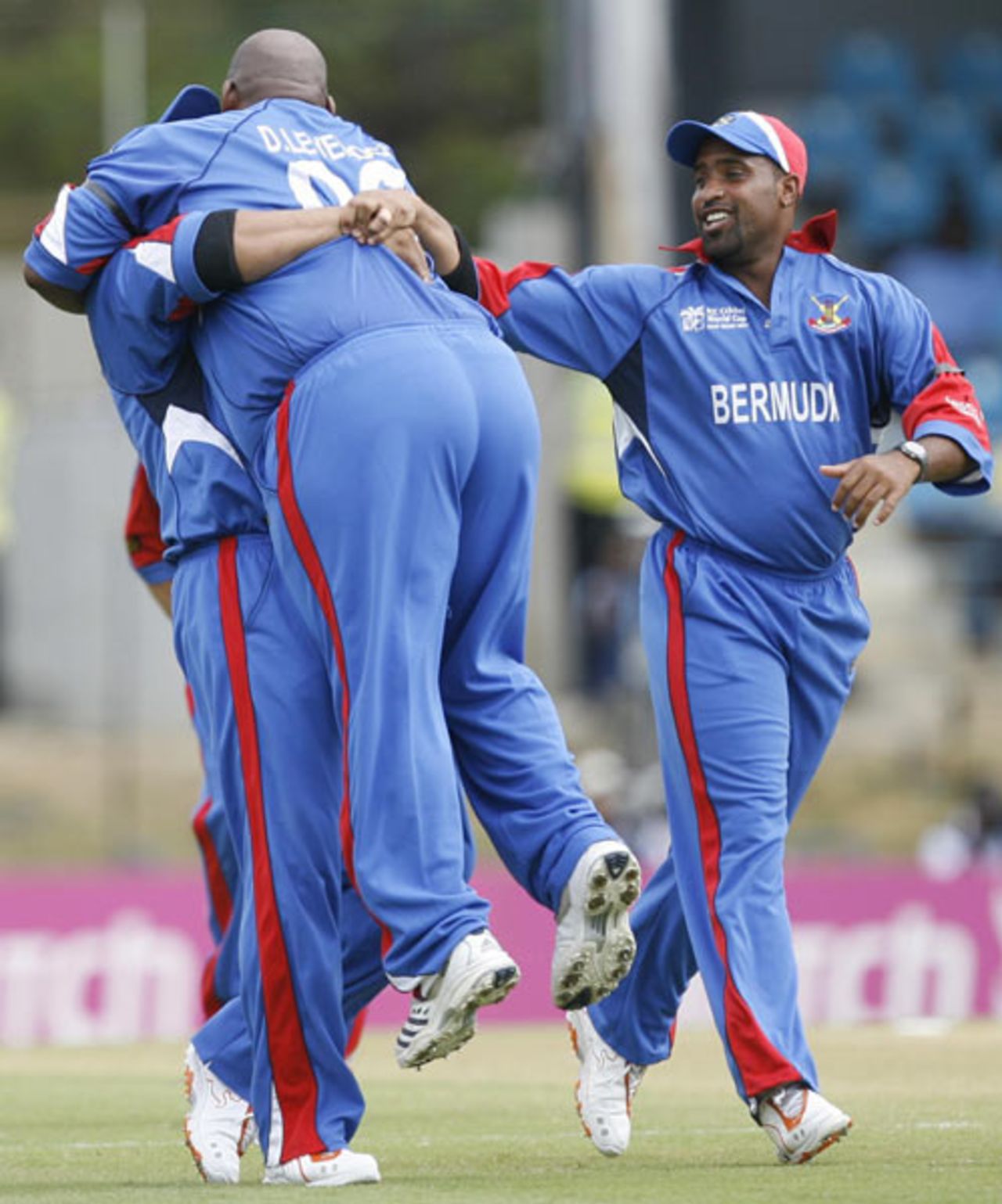 Dwayne Leverock is lifted off his feet by Irvine Romaine as Kwame Tuckerlooks on after a stunning one-handed catch to dismiss Robin Uthappa, Bermuda v India, Group B, Trinidad, March 19, 2007