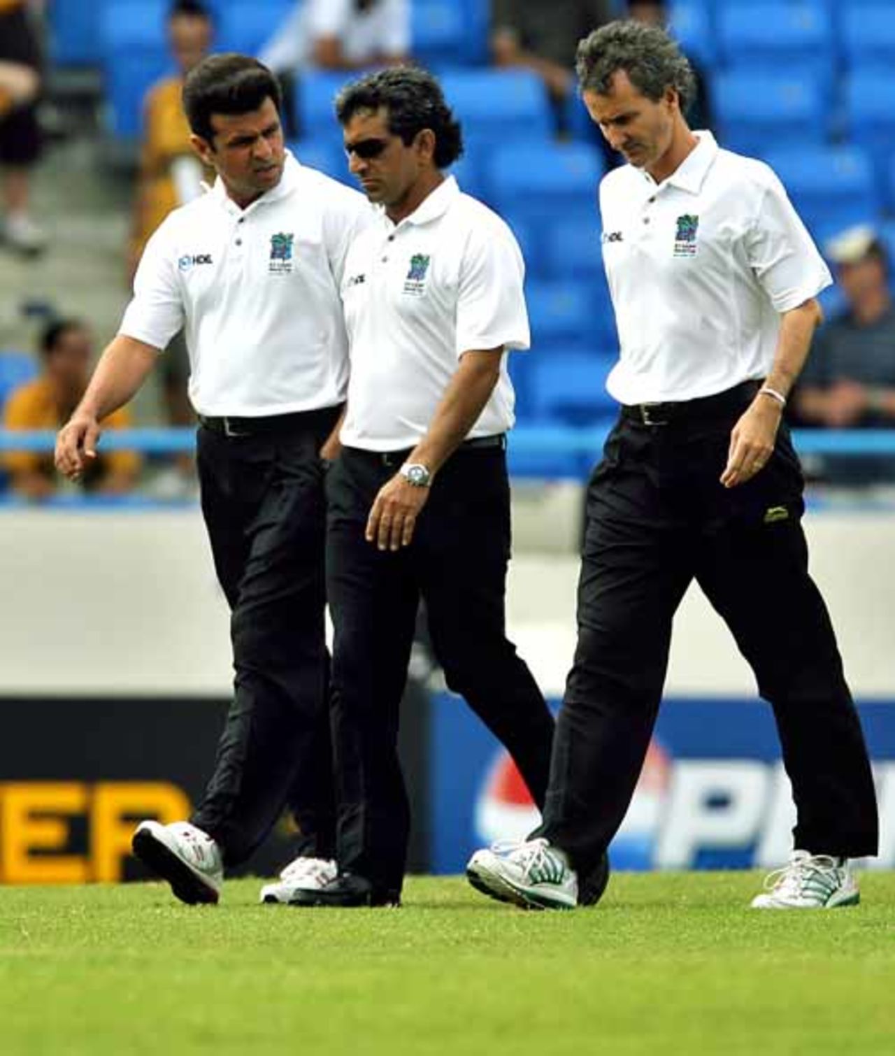 Umpires Aleem Dar, Asad Rauf and Billy Bowden walk down to inspect the pitch, Australia v Bangladesh, Super Eights, Antigua, March 31, 2007