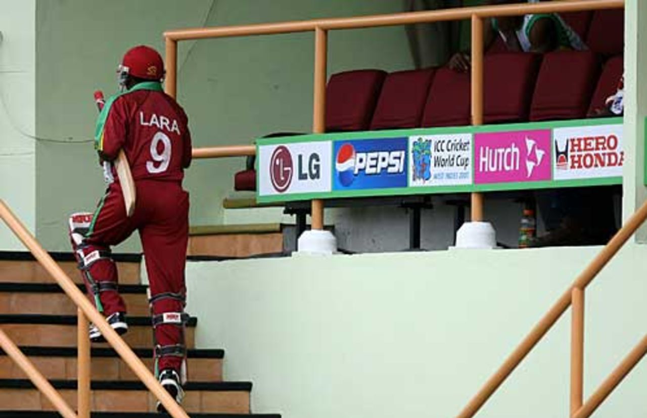 Brian Lara heads back to a quiet West Indian dressing room, West Indies v Sri Lanka, Super Eights, Guyana, April 1, 2007