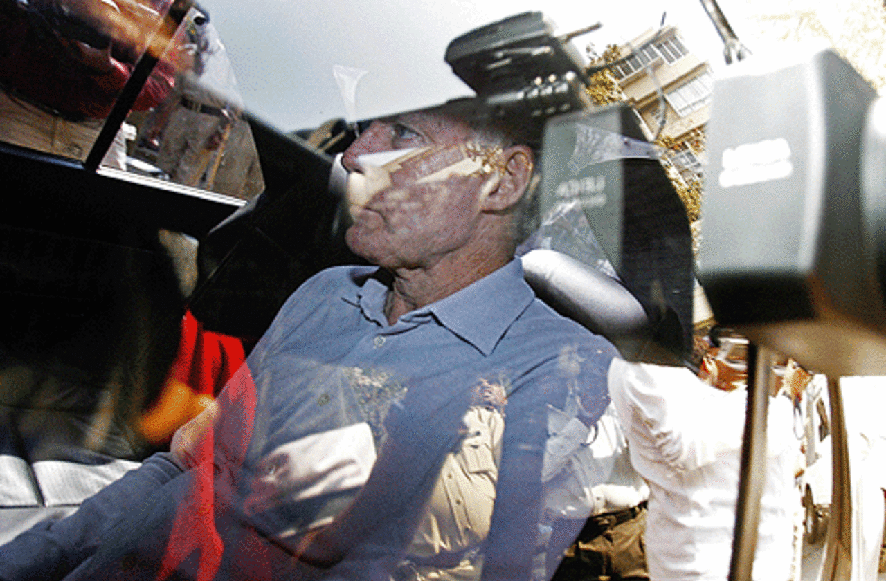 Mediapersons close in on Greg Chappell's car as he arrives for the Indian board meeting, Mumbai. April 6, 2007