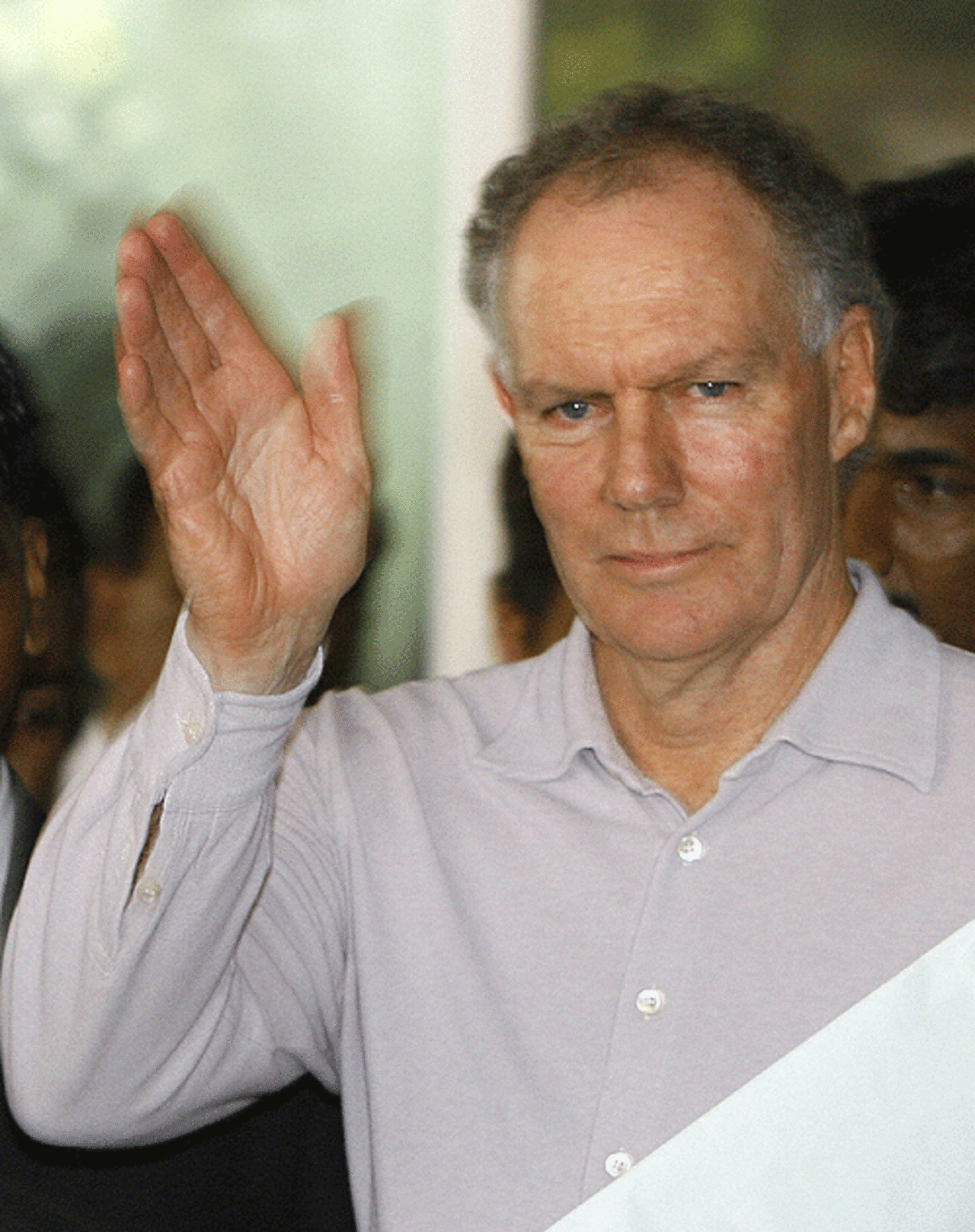 Greg Chappell waves at the waiting media as he leaves the board meeting at the Wankhede Stadium, Mumbai, April 6, 2007