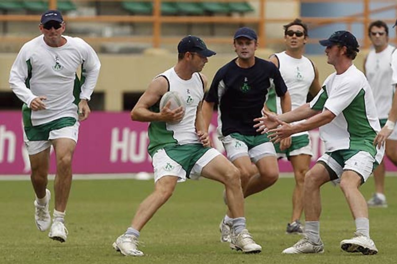 A few Ireland players warm-up with a game a rugby, Providence, Guyana, April 8, 2007