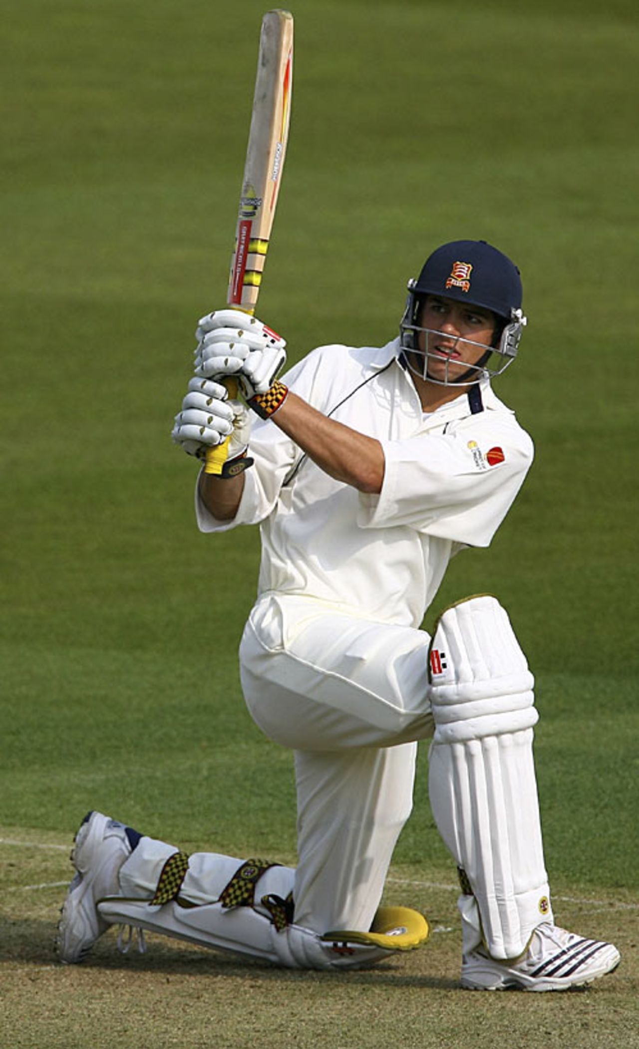 Down on one knee, Alastair Cook slog-sweeps during his hundred, MCC v Sussex, Lord's, April 13, 2007
